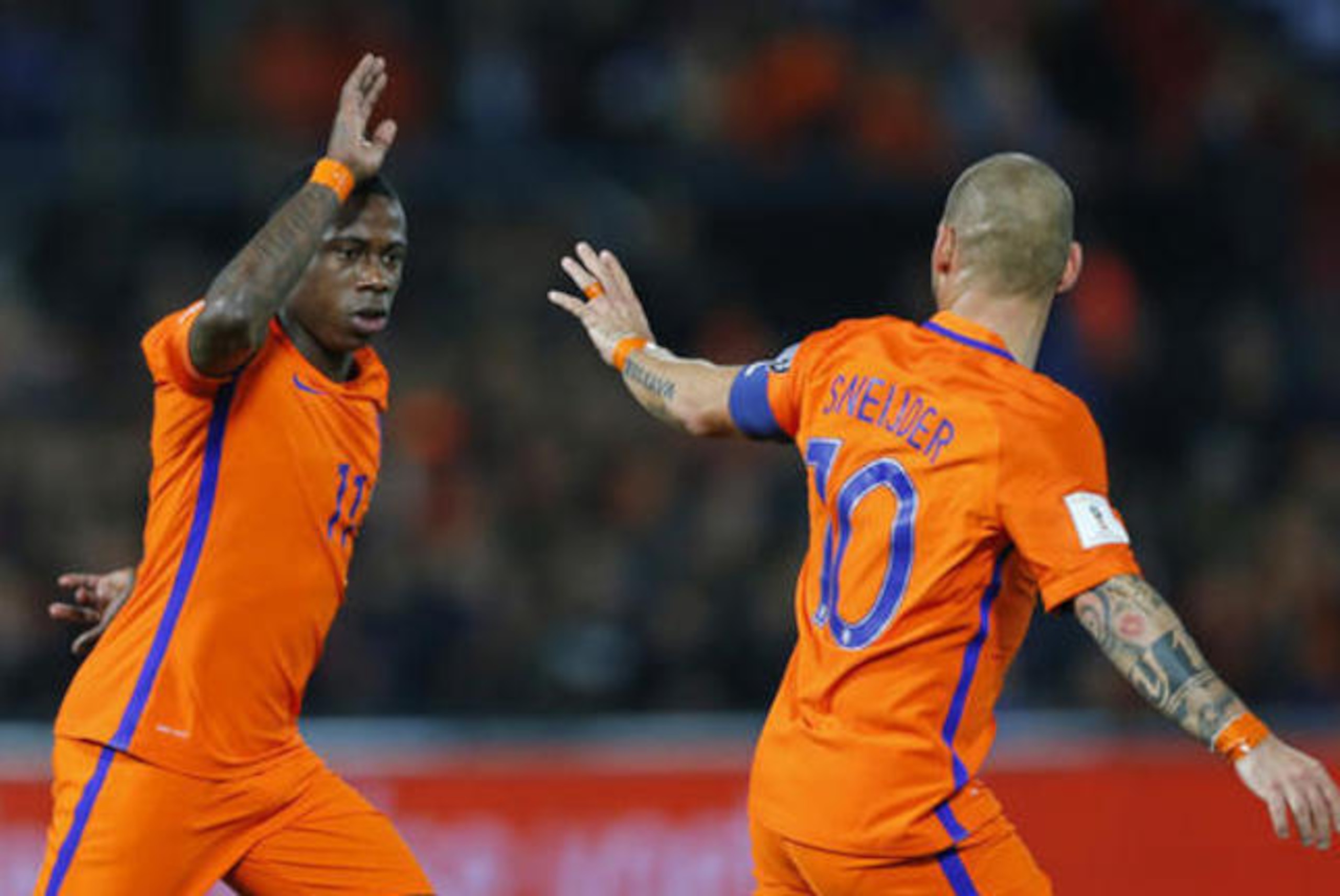 Wesley Sneijder and Quincy Promes celebrate against Belarus, but injury prevented either making an impact against France.
