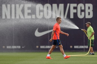 Barcelona's French defender Lucas Digne walks in the field during a training session at the Sports Center FC Barcelona Joan Gamper in Sant Joan Despi, near Barcelona on August 16, 2016, on the eve of the second-leg of the Spanish Super Cup football match 