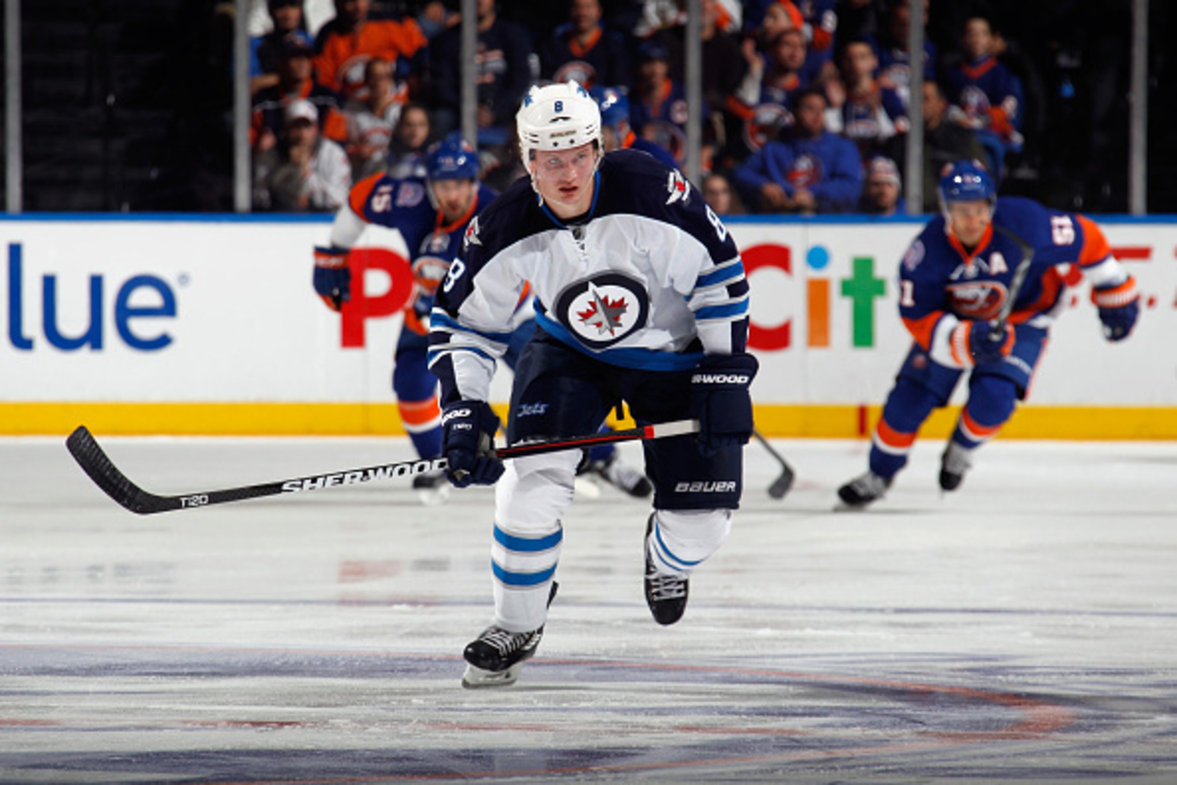 UNIONDALE, NY - OCTOBER 28: Jacob Trouba #8 of the Winnipeg Jets skates against the New York Islanders at the Nassau Veterans Memorial Coliseum on October 28, 2014 in Uniondale, New York.  (Photo by Bruce Bennett/Getty Images)