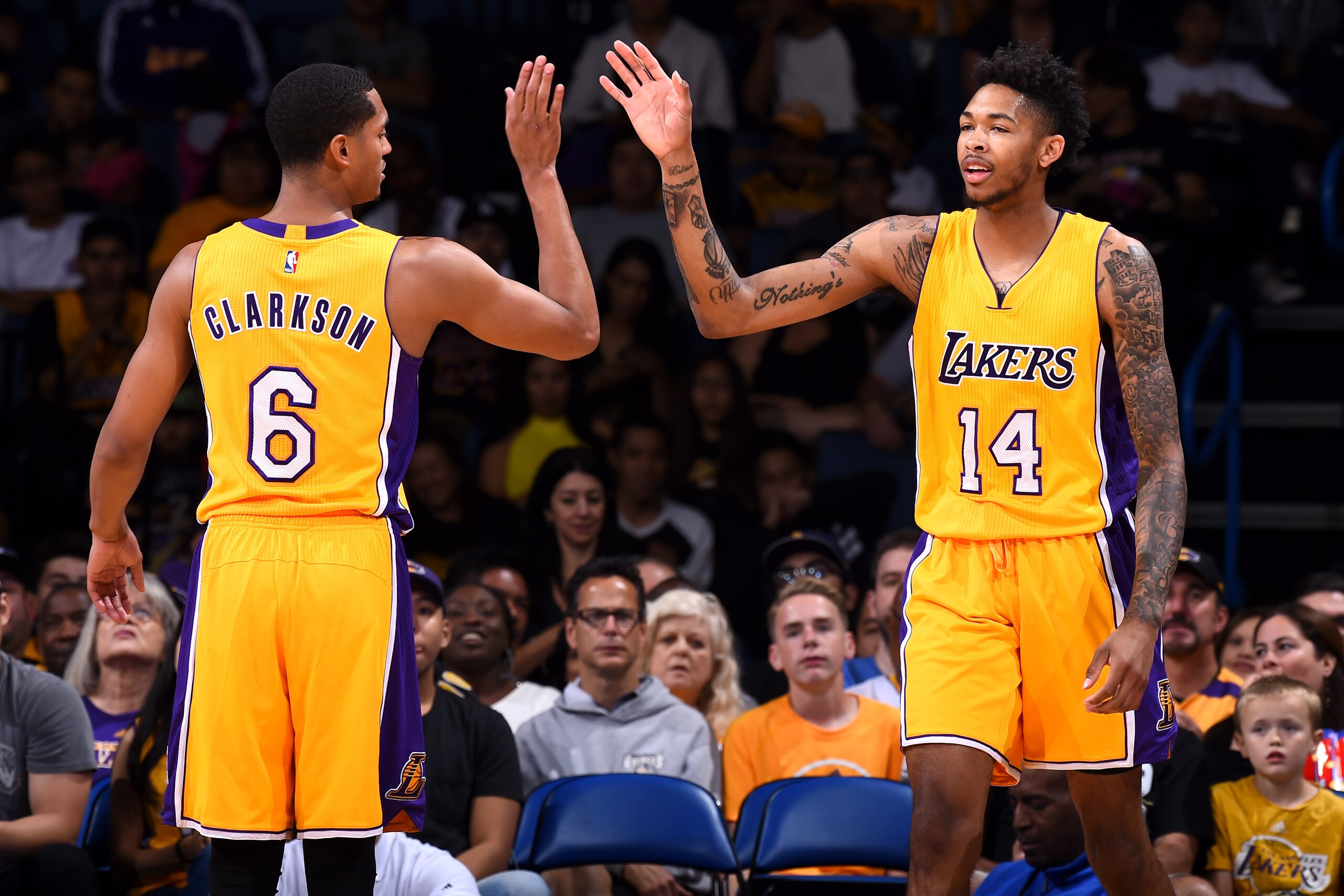 Ontario, CA - OCTOBER 9:  Brandon Ingram #14 and Jordan Clarkson #6 of the Los Angeles Lakers high-five against the Denver Nuggets during a preseason game on October 9, 2016 at Citizens Business Bank Arena in Ontario, California. NOTE TO USER: User expres