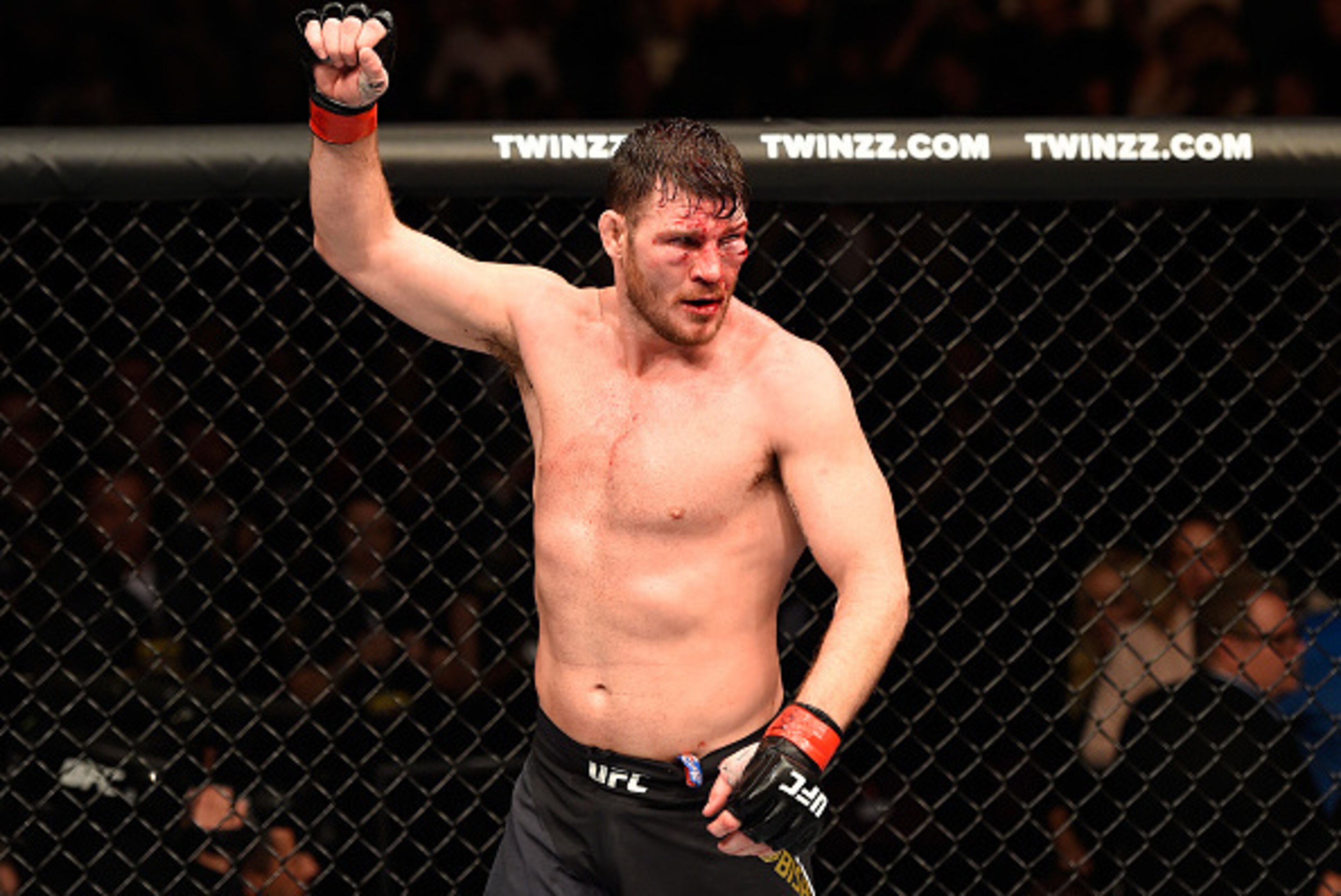 MANCHESTER, ENGLAND - OCTOBER 08:  Michael Bisping of England raises his hand after facing Dan Henderson in their UFC middleweight championship bout during the UFC 204 Fight Night at the Manchester Evening News Arena on October 8, 2016 in Manchester, Engl