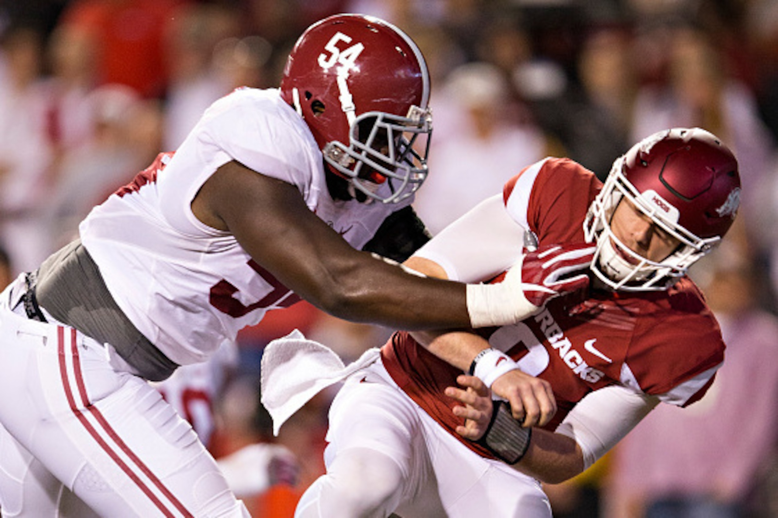 FAYETTEVILLE, AR - OCTOBER 8: Dalvin Tomlinson #54 of the Alabama Crimson Tide shoves Austin Allen #8 of the Arkansas Razorbacks after throwing a pass at Razorback Stadium on October 8, 2016 in Fayetteville, Arkansas. The Crimson Tide defeated the Razor FAYETTEVILLE, AR - OCTOBER 8: Dalvin Tomlinson #54 of the Alabama Crimson Tide shoves Austin Allen #8 of the Arkansas Razorbacks after throwing a pass at Razorback Stadium on October 8, 2016 in Fayetteville, Arkansas. The Crimson Tide defeated the Razor