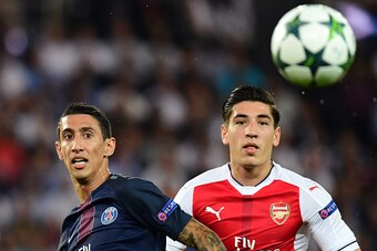 Paris Saint-Germain's Argentinian midfielder Angel Di Maria (L) and Arsenal's Spanish defender Hector Bellerin look at the ball during the UEFA Champions League Group A football match between Paris-Saint-Germain vs Arsenal FC, on September 13, 2016 at the