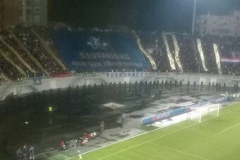 Raised By War, Stronger Than Fear. Kosovo fans unfurl a banner against Croatia