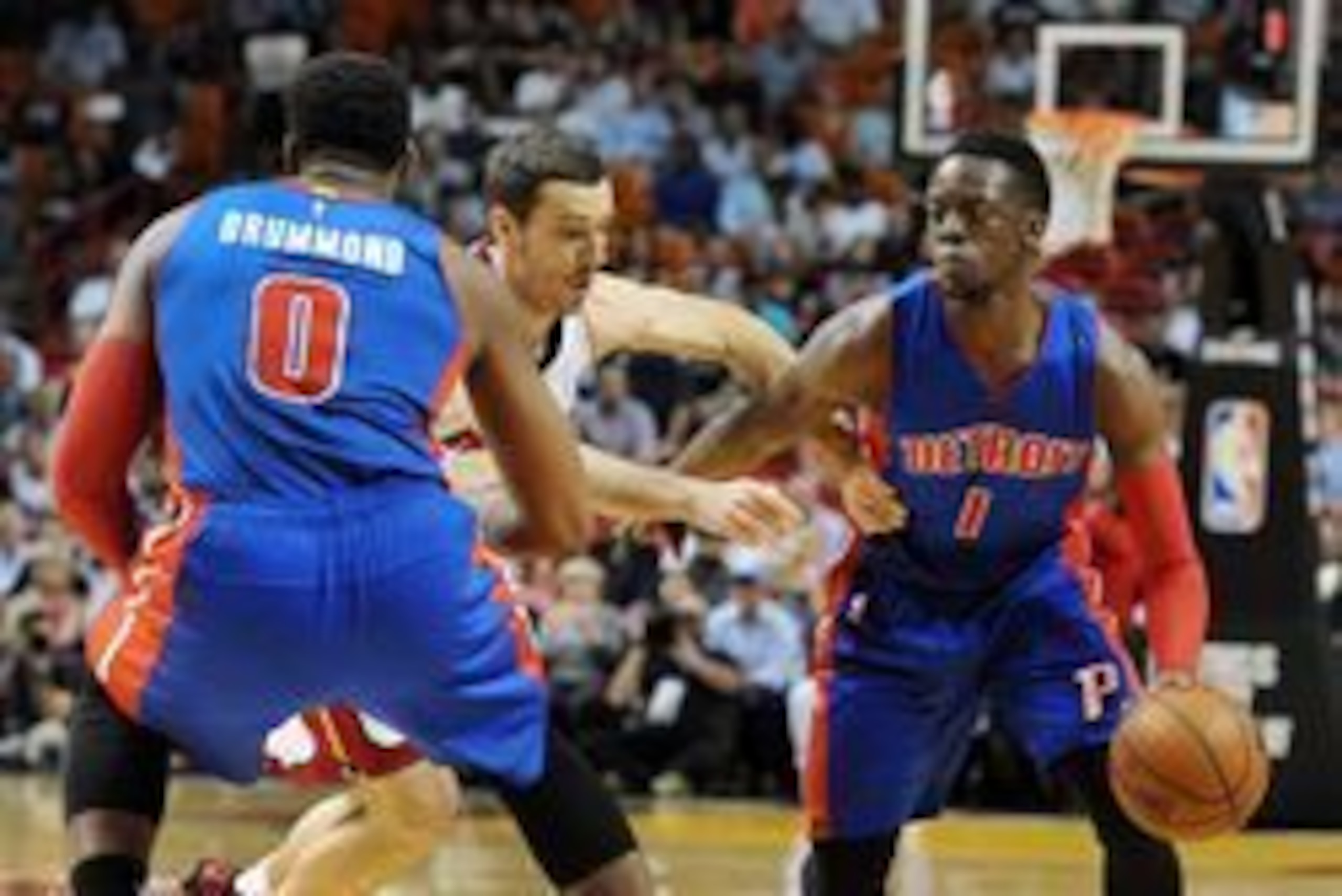 Apr 5, 2016; Miami, FL, USA; Detroit Pistons guard Reggie Jackson (1) looks to get past Miami Heat guard Goran Tragic (center) during the first half of their Tuesday night game at American Airlines Arena. Mandatory Credit: Robert Duyos-USA TODAY Sports