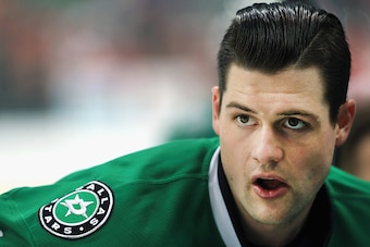 DALLAS, TX - FEBRUARY 29:  Jamie Benn #14 of the Dallas Stars stretches during pregame warmup before taking on the Detroit Red Wings at American Airlines Center on February 29, 2016 in Dallas, Texas.  (Photo by Tom Pennington/Getty Images)