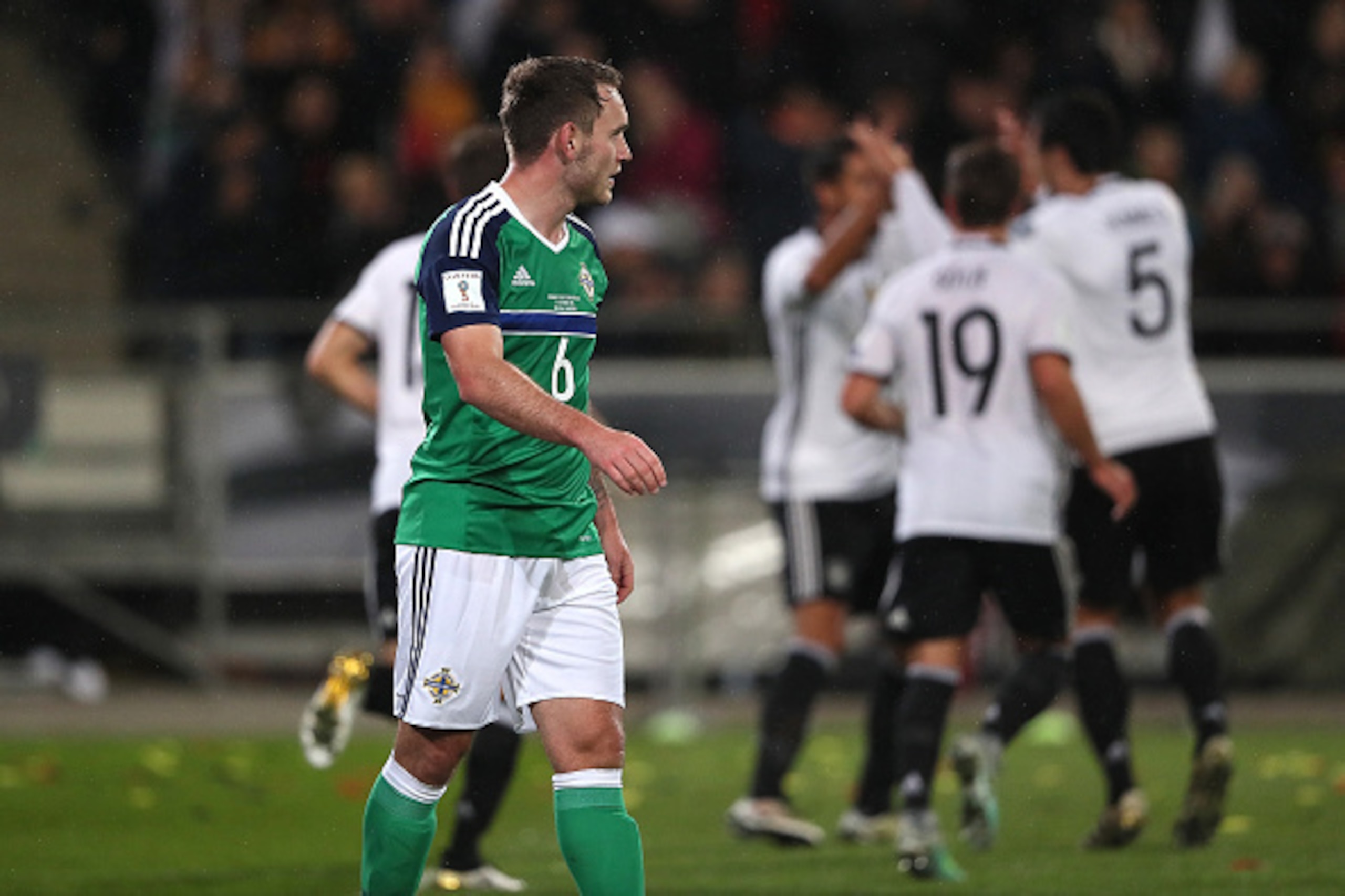 HANOVER, GERMANY - OCTOBER 11:  Sami Khedira of Germany celebrates scoring his team's second goal to make the score 2-0 with his team-mates as Lee Hodson of Northern Ireland looks on during the FIFA 2018 World Cup Qualifier between Germany and Northern Ir