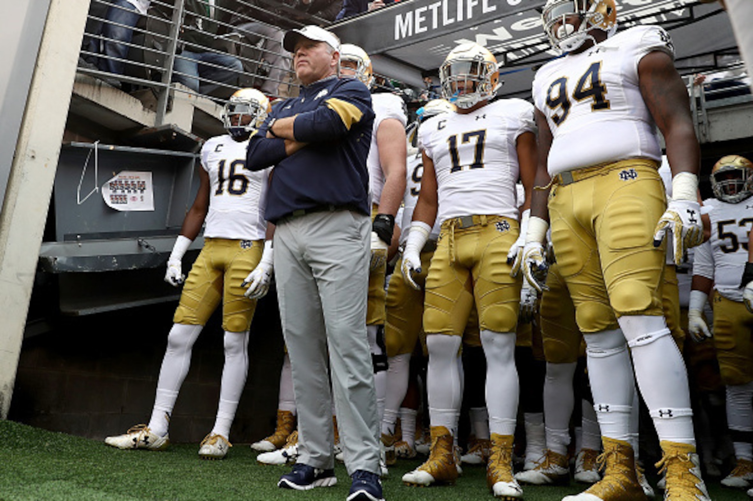 EAST RUTHERFORD, NJ - OCTOBER 01:  Head coach Brian Kelly of the Notre Dame Fighting Irish and his team wait to head on to the field for the start of the game against the Syracuse Orange at MetLife Stadium on October 1, 2016 in East Rutherford, New Jersey