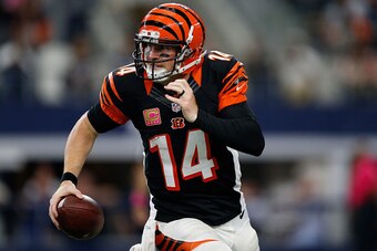 ARLINGTON, TX - OCTOBER 09:   Andy Dalton #14 of the Cincinnati Bengals rushes the ball against the Dallas Cowboys at AT&T Stadium on October 9, 2016 in Arlington, Texas. (Photo by Wesley Hitt/Getty Images)
