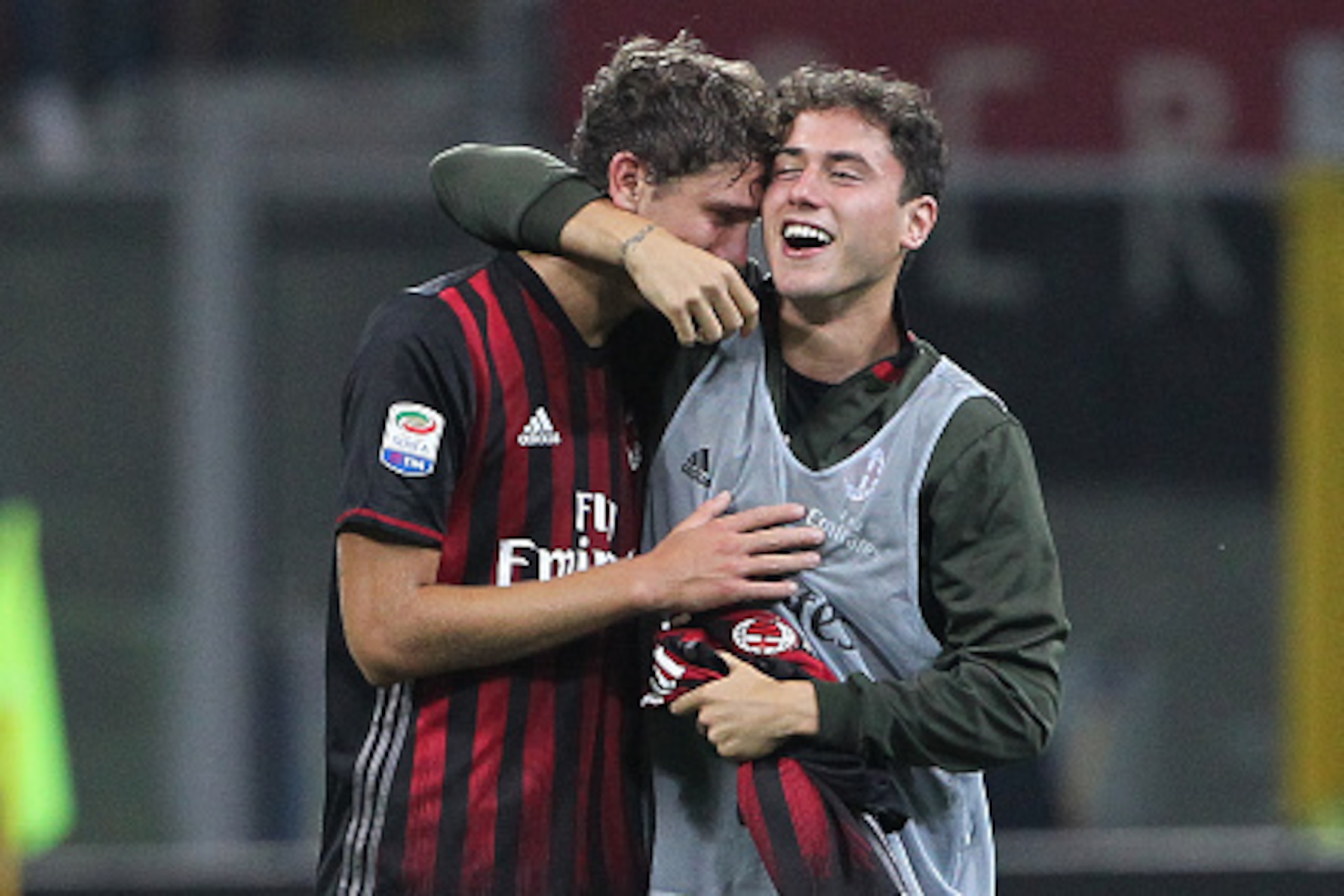 MILAN, ITALY - OCTOBER 02:  Manuel Locatelli (L) and Davide Calabria (R) of AC Milan celebrate a victory at the end of the Serie A match between AC Milan and US Sassuolo at Stadio Giuseppe Meazza on October 2, 2016 in Milan, Italy.  (Photo by Marco Luzzan