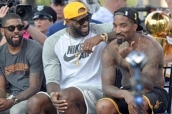 Jun 22, 2016; Cleveland, OH, USA; Cleveland Cavaliers guard Kyrie Irving, forward LeBron James and guard J.R. Smith laugh during the Cleveland Cavaliers NBA championship celebration in downtown Cleveland. Mandatory Credit: Ken Blaze-USA TODAY Sports