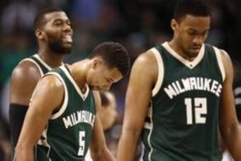 Feb 25, 2016; Boston, MA, USA; Milwaukee Bucks center Greg Monroe (left) and guard Michael Carter-Williams (5) and forward Jabari Parker (12) react during the second of a game against the Boston Celtics half at TD Garden. Mandatory Credit: Mark L. Baer-US