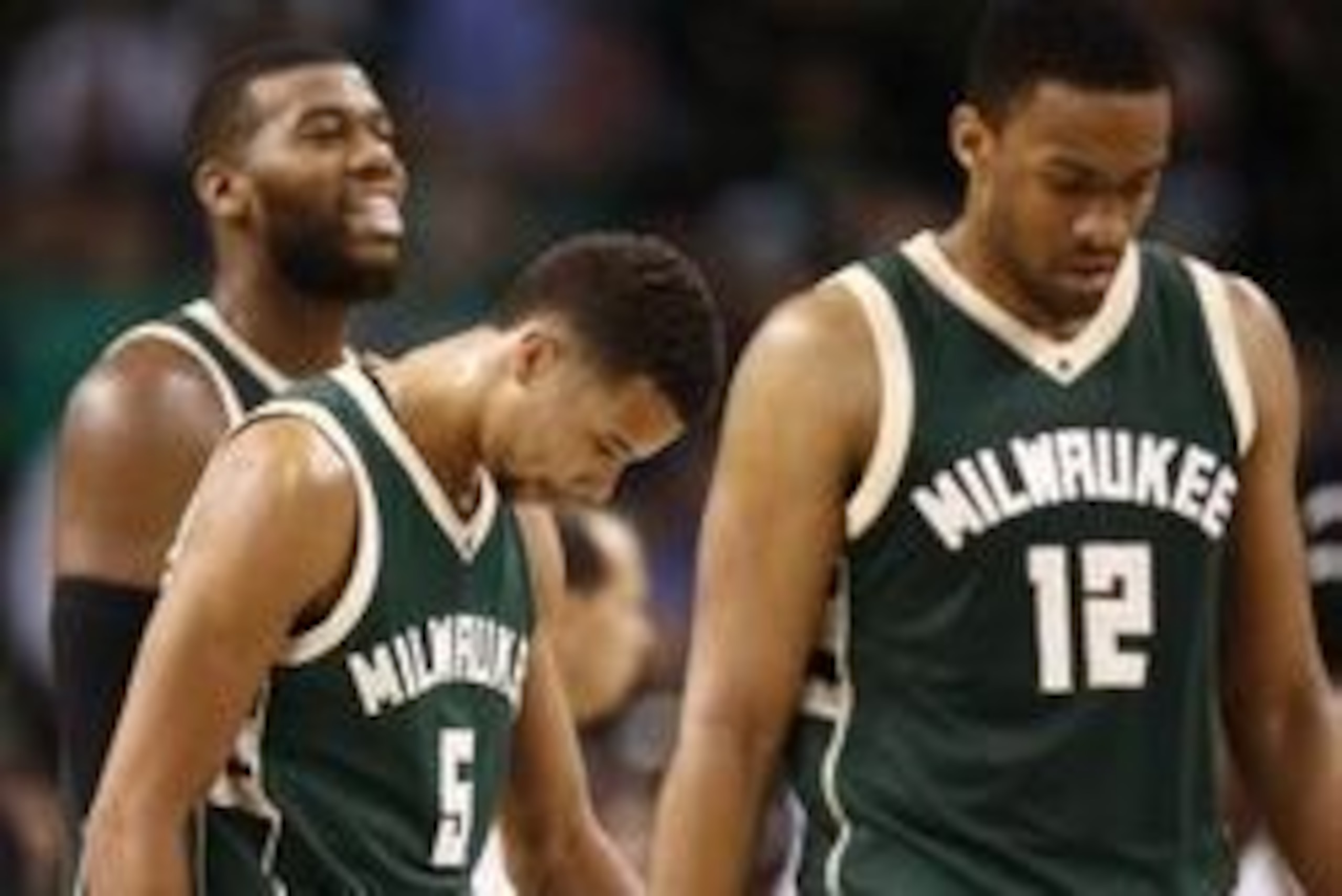Feb 25, 2016; Boston, MA, USA; Milwaukee Bucks center Greg Monroe (left) and guard Michael Carter-Williams (5) and forward Jabari Parker (12) react during the second of a game against the Boston Celtics half at TD Garden. Mandatory Credit: Mark L. Baer-US