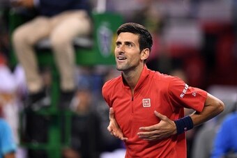 Novak Djokovic of Serbia celebrates beating Fabio Fognini of Italy in their men's singles match at the Shanghai Masters tennis tournament on October 11, 2016. / AFP / JOHANNES EISELE        (Photo credit should read JOHANNES EISELE/AFP/Getty Images)