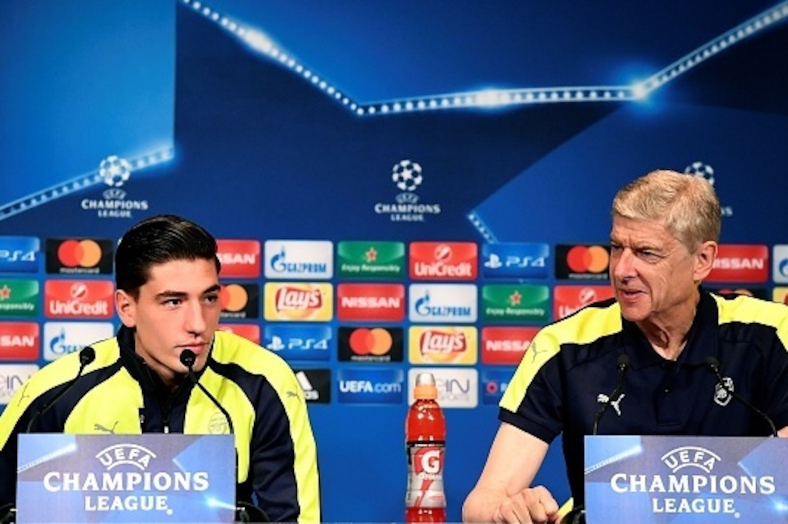 Arsenal's French manager Arsene Wenger (R) and Arsenal's Spanish defender Hector Bellerin give a press conference on the eve of the team's UEFA Champions League football match against Paris Saint-Germain (PSG), on September 12, 2016 at the Parc des Prince