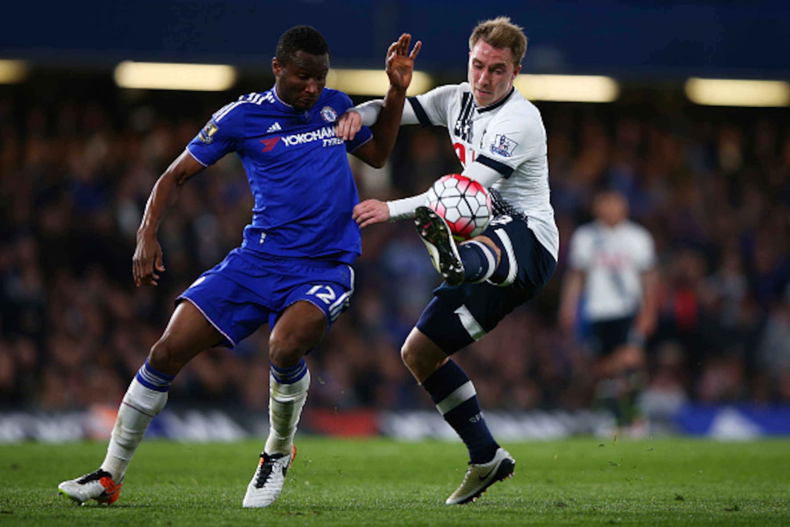 LONDON, ENGLAND - MAY 02:  John Mikel Obi of Chelsea and Christian Eriksen of Tottenham Hotspur battle for the ball during the Barclays Premier League match between Chelsea and Tottenham Hotspur at Stamford Bridge on May 02, 2016 in London, England.  (Pho