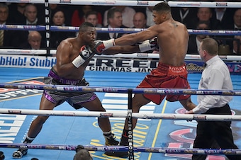 LONDON, ENGLAND - DECEMBER 12:  Dillian Whyte (L) boxing Anthony Joshua MBE  for the Commonwealth Heavyweight title, Vacant British Heavyweight title and WBC International Heavyweight title at The O2 Arena on December 12, 2015 in London, England.  (Photo 