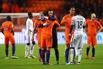 AMSTERDAM, NETHERLANDS - OCTOBER 10:  Tottenham Hotspur players Hugo Lloris of France and Vincent Janssen of the Netherlands embrace after the FIFA 2018 World Cup Qualifier between Netherlands and France held at Amsterdam Arena on October 10, 2016 in Amst