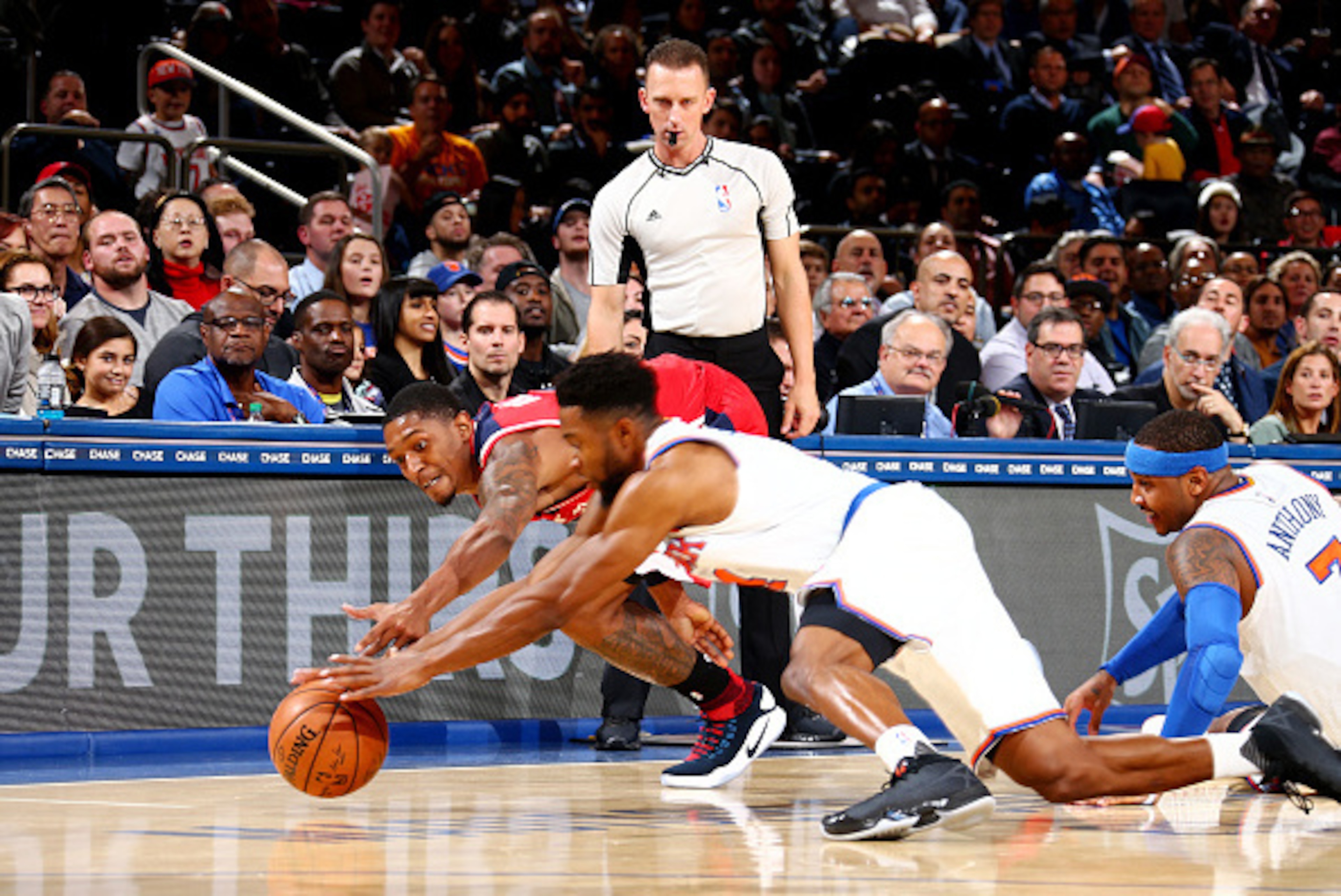 NEW YORK, NY - OCTOBER 10: Chasson Randle #4 of the New York Knicks and Bradley Beal #3 of the Washington Wizards dive for the ball during a preseason game on October 10, 2016 at Madison Square Garden in New York City, New York. NOTE TO USER: User expres NEW YORK, NY - OCTOBER 10: Chasson Randle #4 of the New York Knicks and Bradley Beal #3 of the Washington Wizards dive for the ball during a preseason game on October 10, 2016 at Madison Square Garden in New York City, New York. NOTE TO USER: User expres