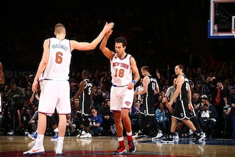 NEW YORK, NY - OCTOBER 8: Kristaps Porzingis #6 and Sasha Vujacic #18 of the New York Knicks celebrate against the Brooklyn Nets  at Madison Square Garden in New York City on OCTOBER 8, 2016.  NOTE TO USER: User expressly acknowledges and agrees that, by 