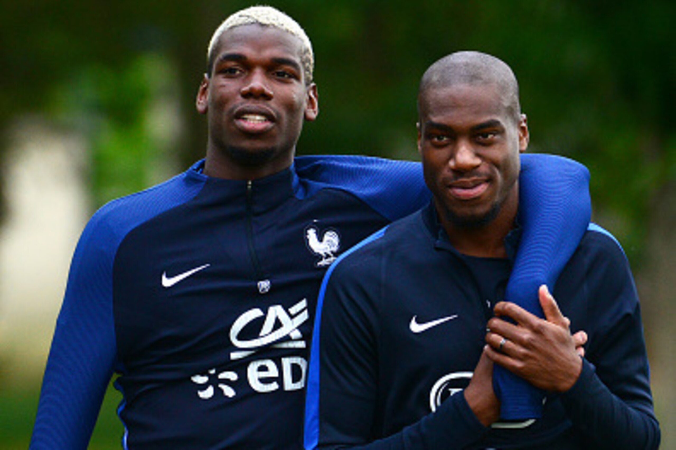 CLAIREFONTAINE, FRANCE - AUGUST 29:  French Football Team midfielder Geoffrey Kondogbia( R) and midfielder Paul Pogba(L) during a training session on August 29, 2016 in Clairefontaine, France. The training session comes before the upcoming friendly match 