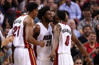 MIAMI, FLORIDA - APRIL 05: Justise Winslow #20 of the Miami Heat celebrates with teammates Hassan Whiteside #21 and Josh Richardson #0 during the game against the Detroit Pistons at the American Airlines Arena on April 5, 2016 in Miami, Florida. Miami def