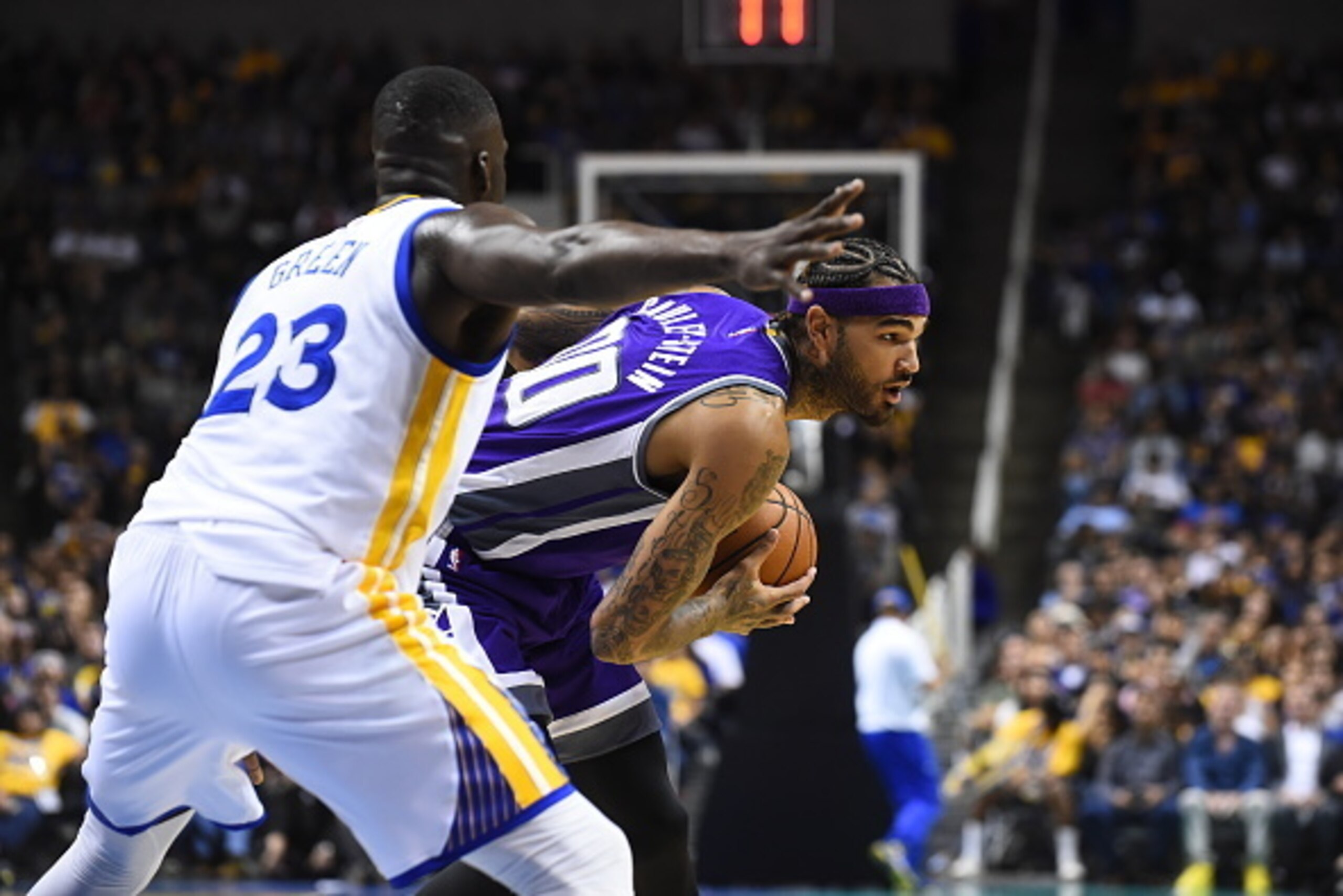 SAN JOSE, CA - OCTOBER 6:   Willie Cauley-Stein #00 of the Sacramento Kings handles the ball against Draymond Green #23 of the Golden State Warriors on October 6, 2016 at SAP Center in San Jose, California. NOTE TO USER: User expressly acknowledges and ag
