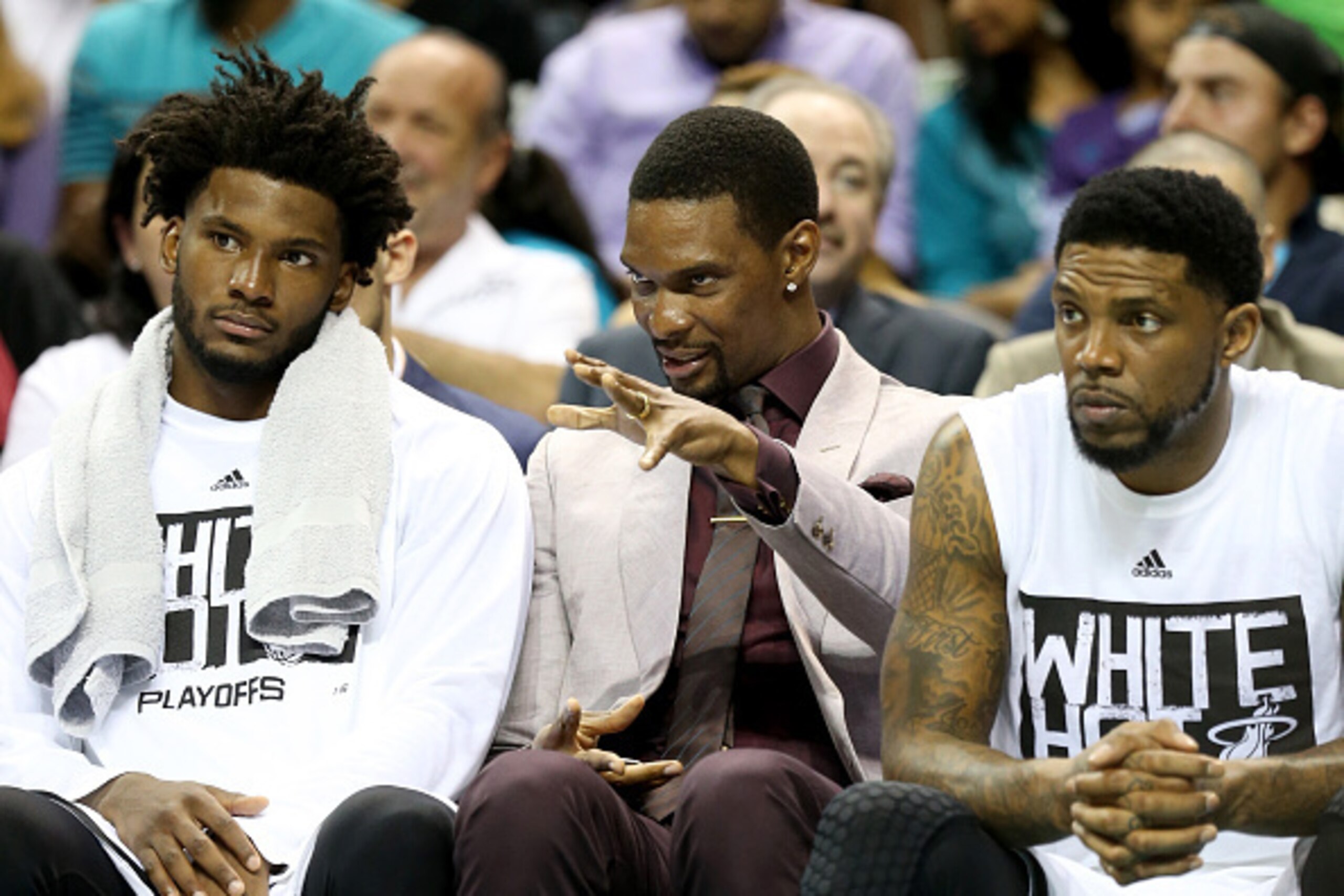 CHARLOTTE, NC - APRIL 23:  Chris Bosh #1 of the Miami Heat talks to teammates Justise Winslow #20 and Udonis Haslem #40 against the Charlotte Hornets during game three of the Eastern Conference Quarterfinals of the 2016 NBA Playoffs at Time Warner Cable A
