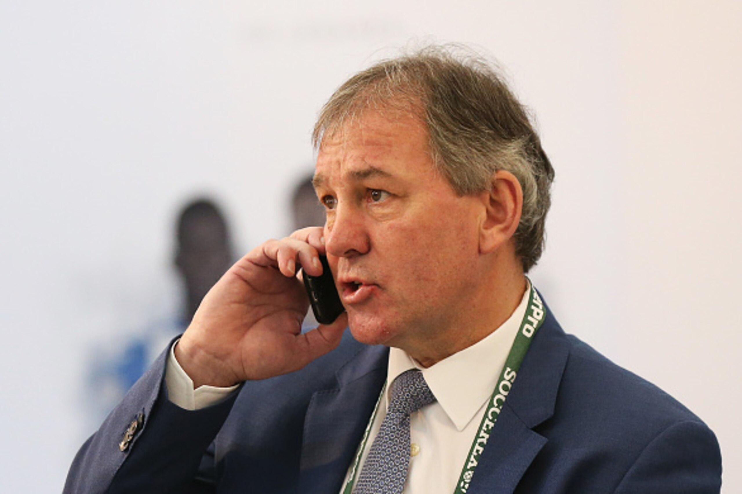 MANCHESTER, ENGLAND - SEPTEMBER 28: Former England captain Bryan Robson talks on his mobile phone in the VIP area during day 3 of the Soccerex Global Convention 2016 at Manchester Central Convention Complex on September 28, 2016 in Manchester, England.  (