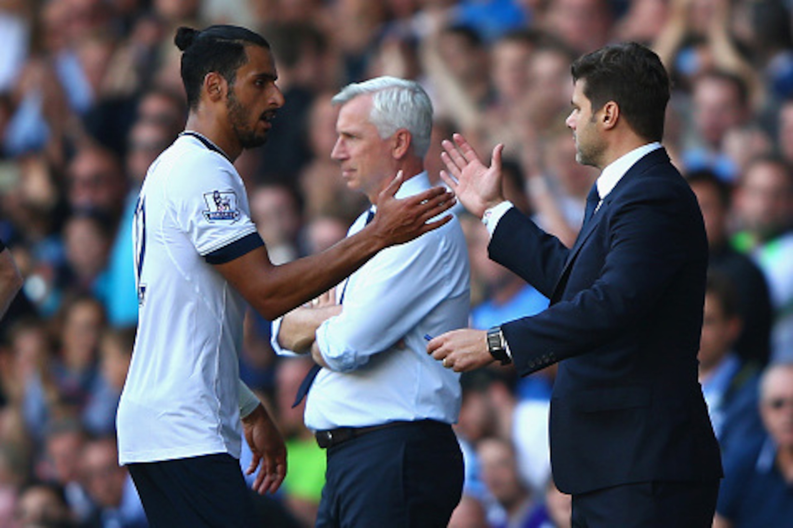 LONDON, ENGLAND - SEPTEMBER 20: Nacer Chadli of Tottenham Hotspur shakes hands with Mauricio Pochettino manager of Tottenham Hotspur as he is replaced during the Barclays Premier League match between Tottenham Hotspur and Crystal Palace at White Hart Lane
