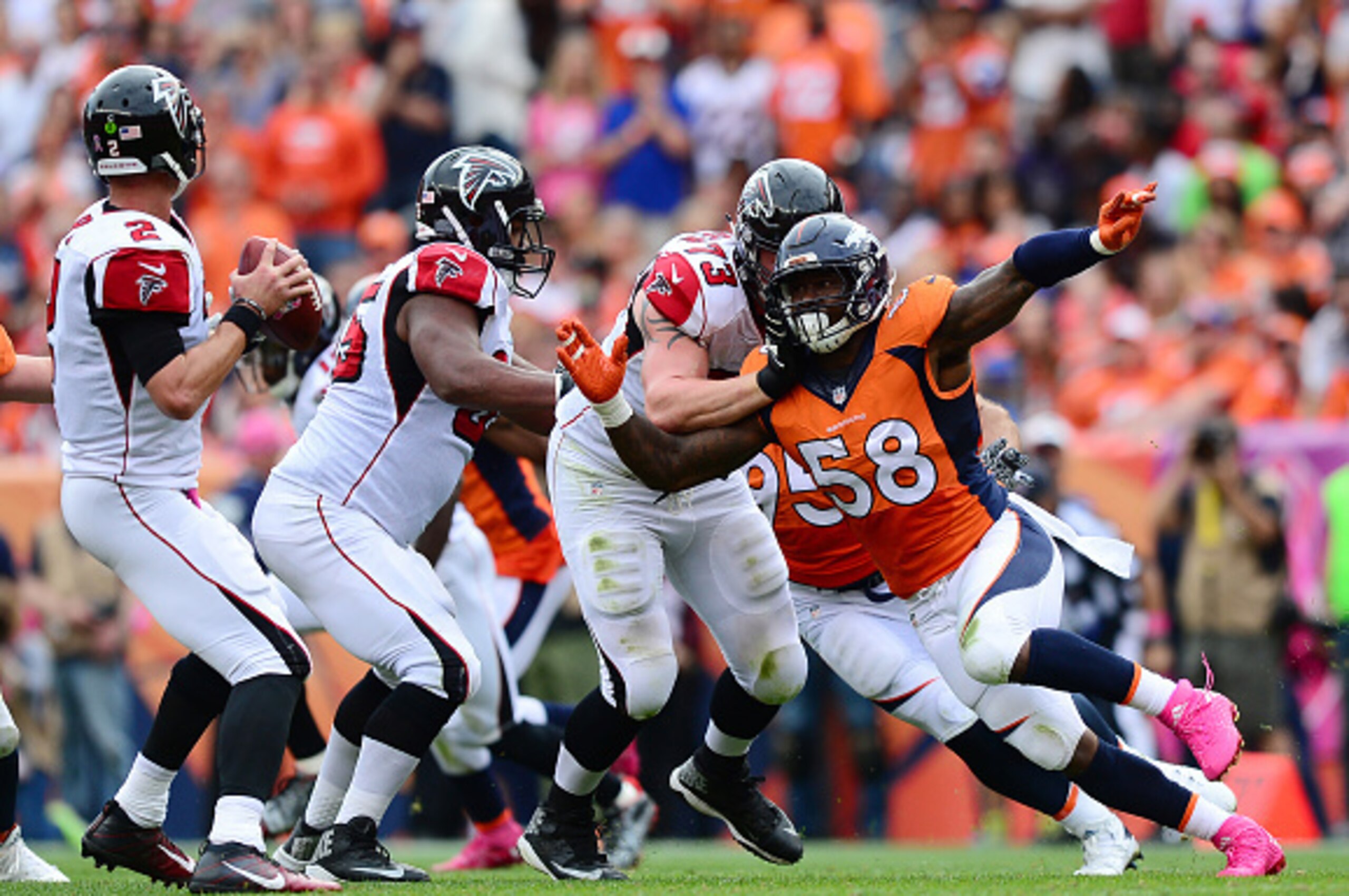 DENVER, CO - OCTOBER 9:  Outside linebacker Von Miller #58 of the Denver Broncos tries to get around tackle Ryan Schraeder #73 of the Atlanta Falcons to tackle quarterback Matt Ryan #2 in the first half of the game at Sports Authority Field at Mile High o