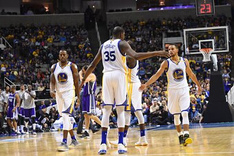 SAN JOSE, CA - OCTOBER 6: Kevin Durant #35 of the Golden State Warriors shakes hands with Stephen Curry #30 during a preseason game against the Sacramento Kings on October 6, 2016 at SAP Center in San Jose, California. NOTE TO USER: User expressly acknowl