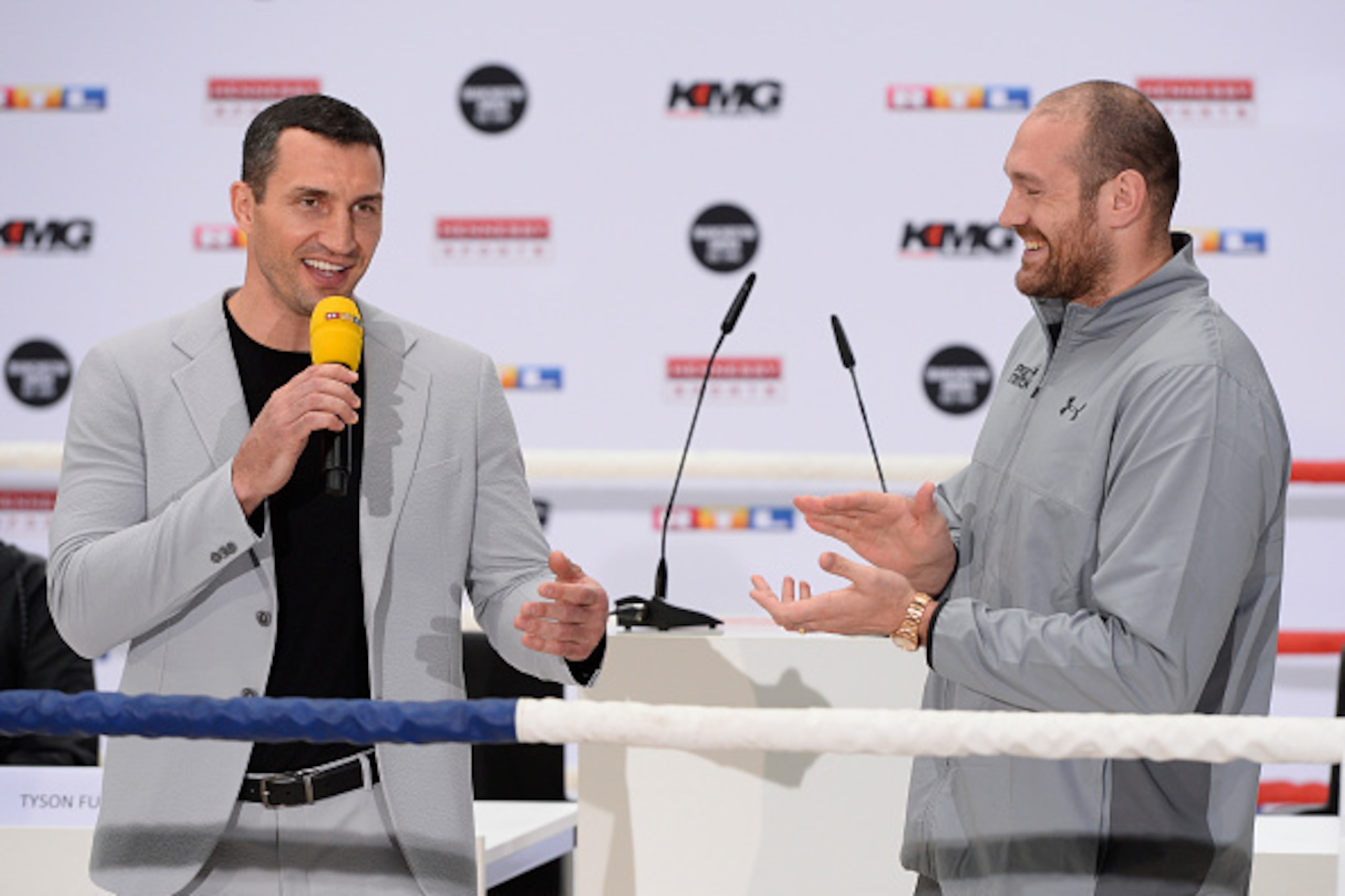 Ukrainian boxer Wladimir Klitschko (L) and British heavyweight world champion Tyson Fury give a press conference in Cologne, western Germany, on April 28, 2016, where they talked about their re-match-fight for the title to take place on July 9, 2016 in Ma