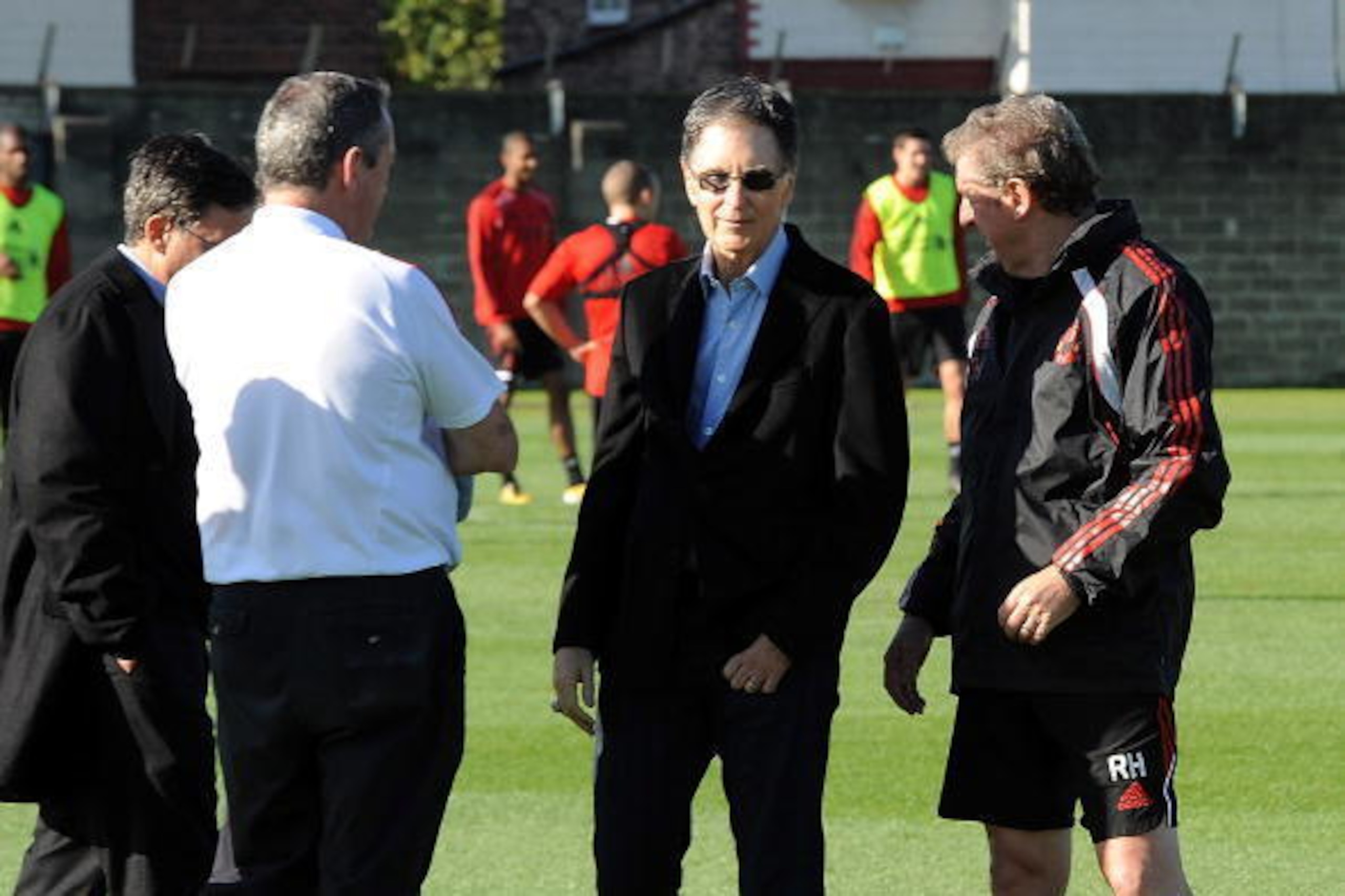 LIVERPOOL, ENGLAND - OCTOBER 16: (THE SUN OUT) (SALES OUT)  In this handout image supplied by Liverpool Football Club, new owner John W. Henry meets manager Roy Hodgson during a team training session at Melwood training ground on October 16, 2010 in Liver