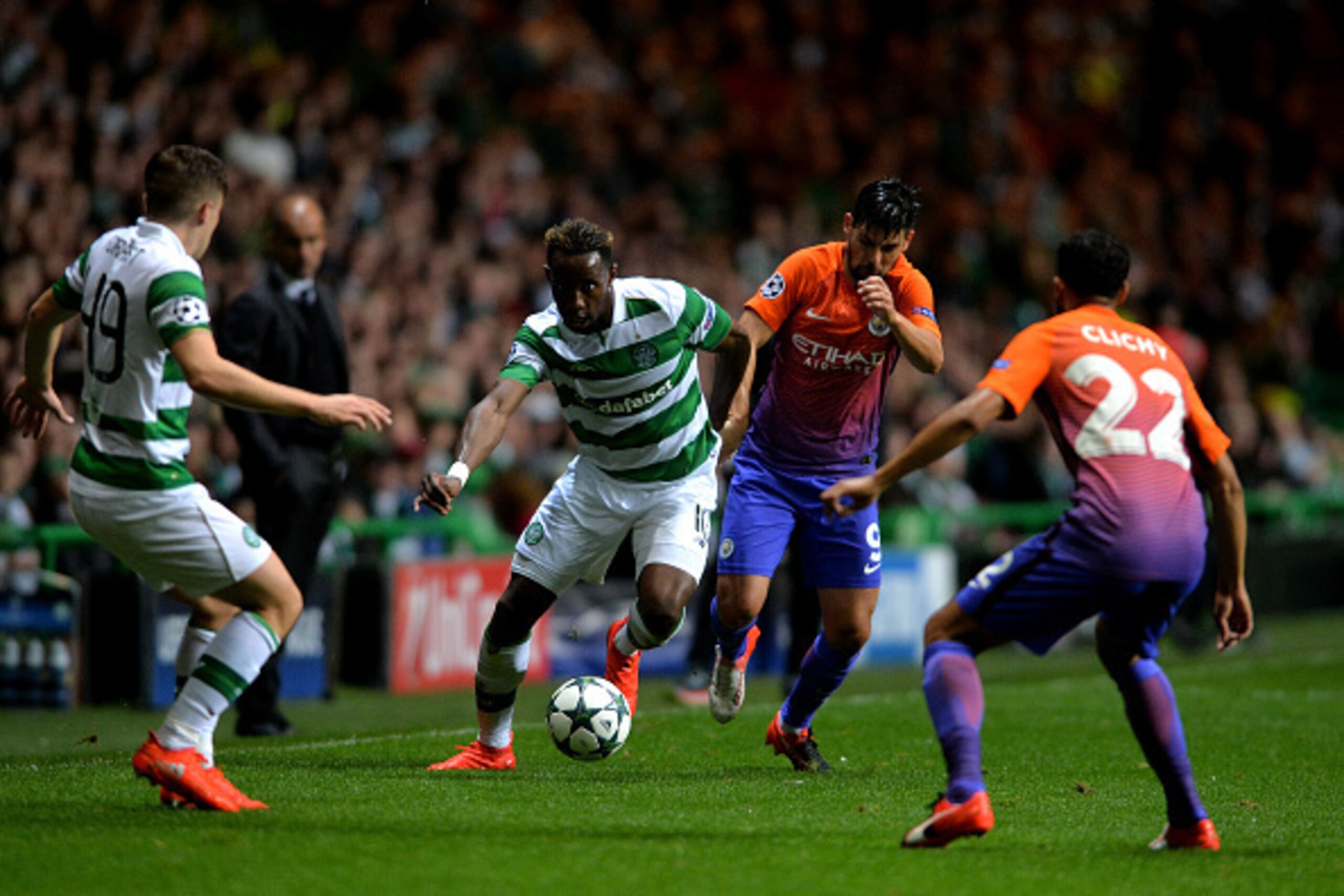 GLASGOW, SCOTLAND - SEPTEMBER 28:  Moussa Dembele of Celtic runs with the ball under pressure from Gael Clichy and Nolito of Manchester City during the UEFA Champions League group C match between Celtic FC and Manchester City FC at Celtic Park on Septembe