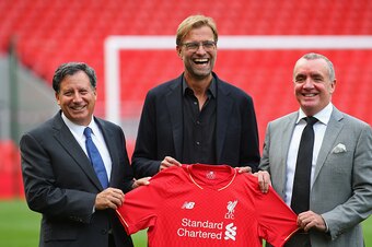 LIVERPOOL, ENGLAND - OCTOBER 09:  Jurgen Klopp at Anfield is unveiled as the new manager of Liverpool FC as he stands alongside Tom Werner (l) the chairman and Ian Ayre (r) the chief executive during a photocall at Anfield on October 9, 2015 in Liverpool,