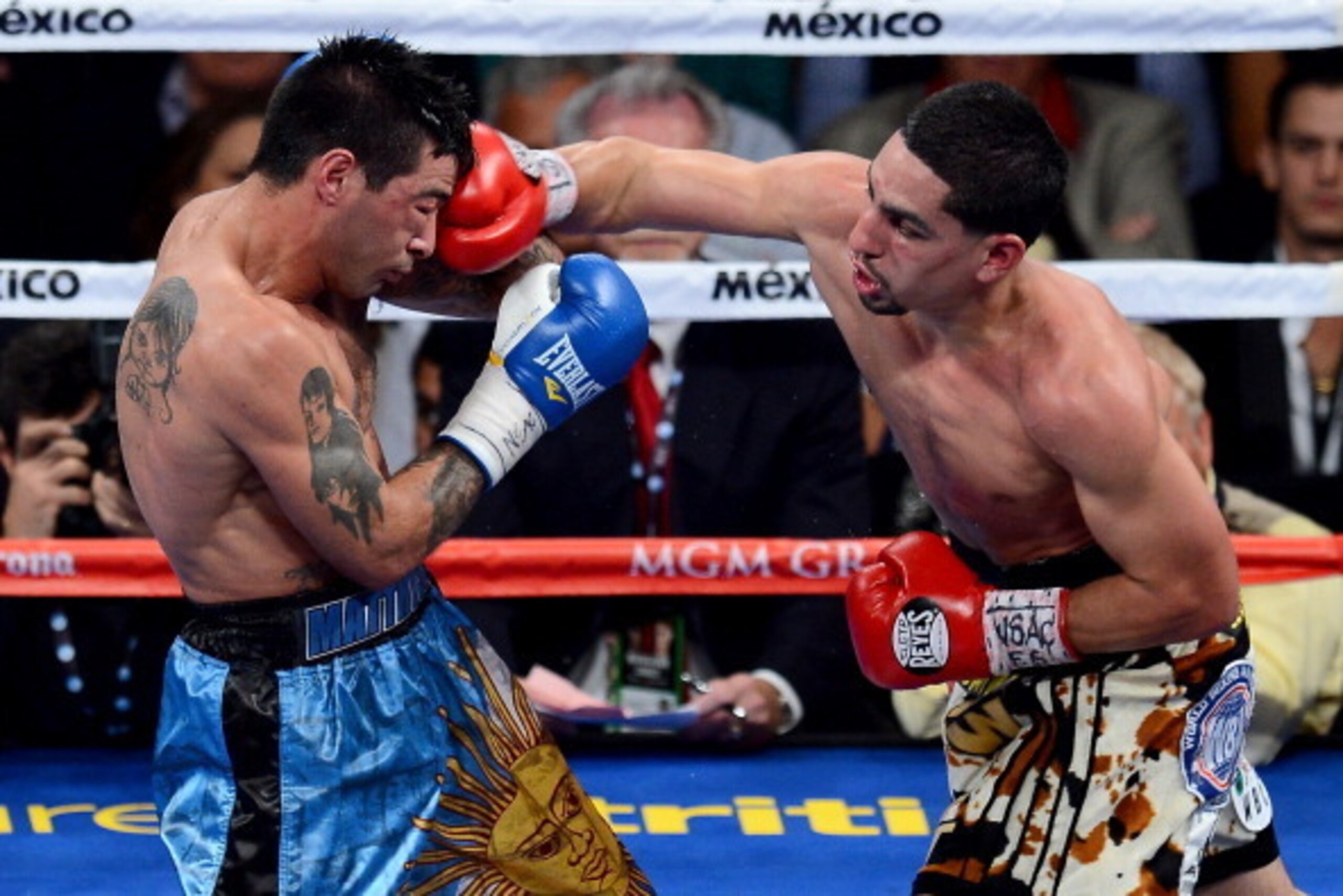 LAS VEGAS, NV - SEPTEMBER 14:  (R-L) Danny Garcia throws a right at Lucas Matthysse during their WBC/WBA super lightweight title fight at the MGM Grand Garden Arena on September 14, 2013 in Las Vegas, Nevada.  (Photo by Ethan Miller/Getty Images)