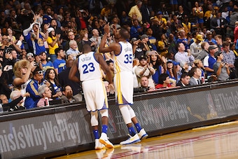 OAKLAND, CA - OCTOBER 4:  Kevin Durant #35 of the Golden State Warriors and Draymond Green #23 of the Golden State Warriors before the game against the Los Angeles Clippers during a preseason game on October 4, 2016 at ORACLE Arena in Oakland, California.