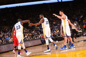 OAKLAND, CA - OCTOBER 4:  Kevin Durant #35 of the Golden State Warriors shakes hands with Draymond Green #23 of the Golden State Warriors during the game against the Los Angeles Clippers during a preseason game on October 4, 2016 at ORACLE Arena in Oaklan