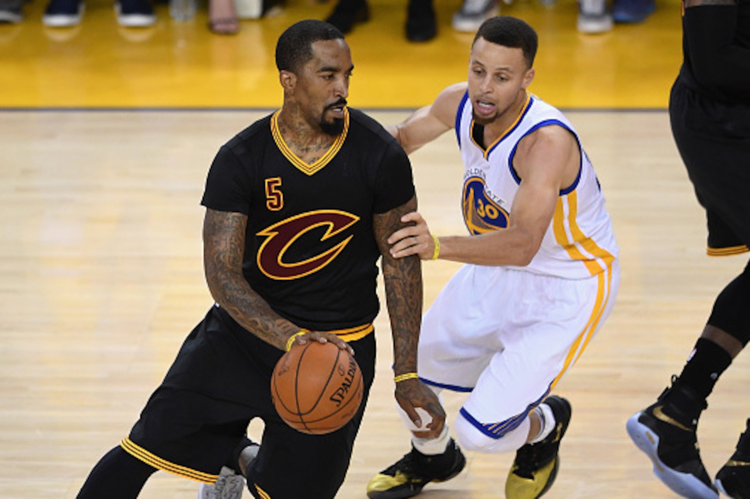 OAKLAND, CA - JUNE 19: J.R. Smith #5 of the Cleveland Cavaliers dribbles against Stephen Curry #30 of the Golden State Warriors in Game 7 of the 2016 NBA Finals at ORACLE Arena on June 19, 2016 in Oakland, California. NOTE TO USER: User expressly acknowl OAKLAND, CA - JUNE 19: J.R. Smith #5 of the Cleveland Cavaliers dribbles against Stephen Curry #30 of the Golden State Warriors in Game 7 of the 2016 NBA Finals at ORACLE Arena on June 19, 2016 in Oakland, California. NOTE TO USER: User expressly acknowl