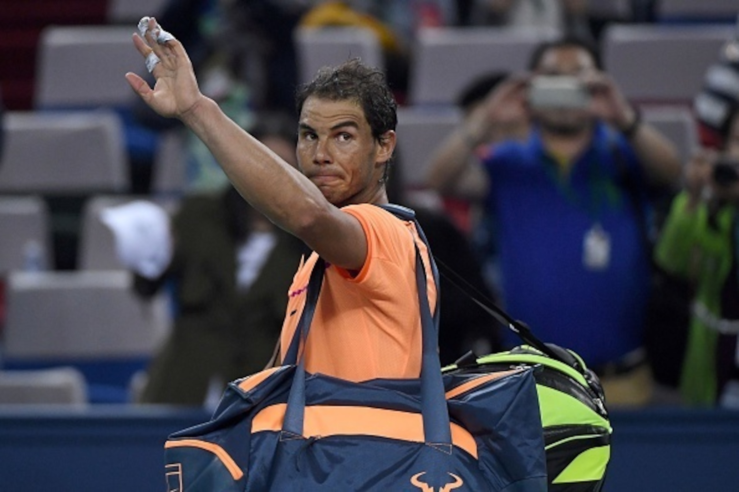 Rafael Nadal of Spain waves as he leaves after his men's singles match against Viktor Troicki of Serbia at the Shanghai Masters tennis tournament in Shanghai on October 12, 2016. / AFP / WANG ZHAO (Photo credit should read WANG ZHAO/AFP/Getty Image Rafael Nadal of Spain waves as he leaves after his men's singles match against Viktor Troicki of Serbia at the Shanghai Masters tennis tournament in Shanghai on October 12, 2016. / AFP / WANG ZHAO (Photo credit should read WANG ZHAO/AFP/Getty Image