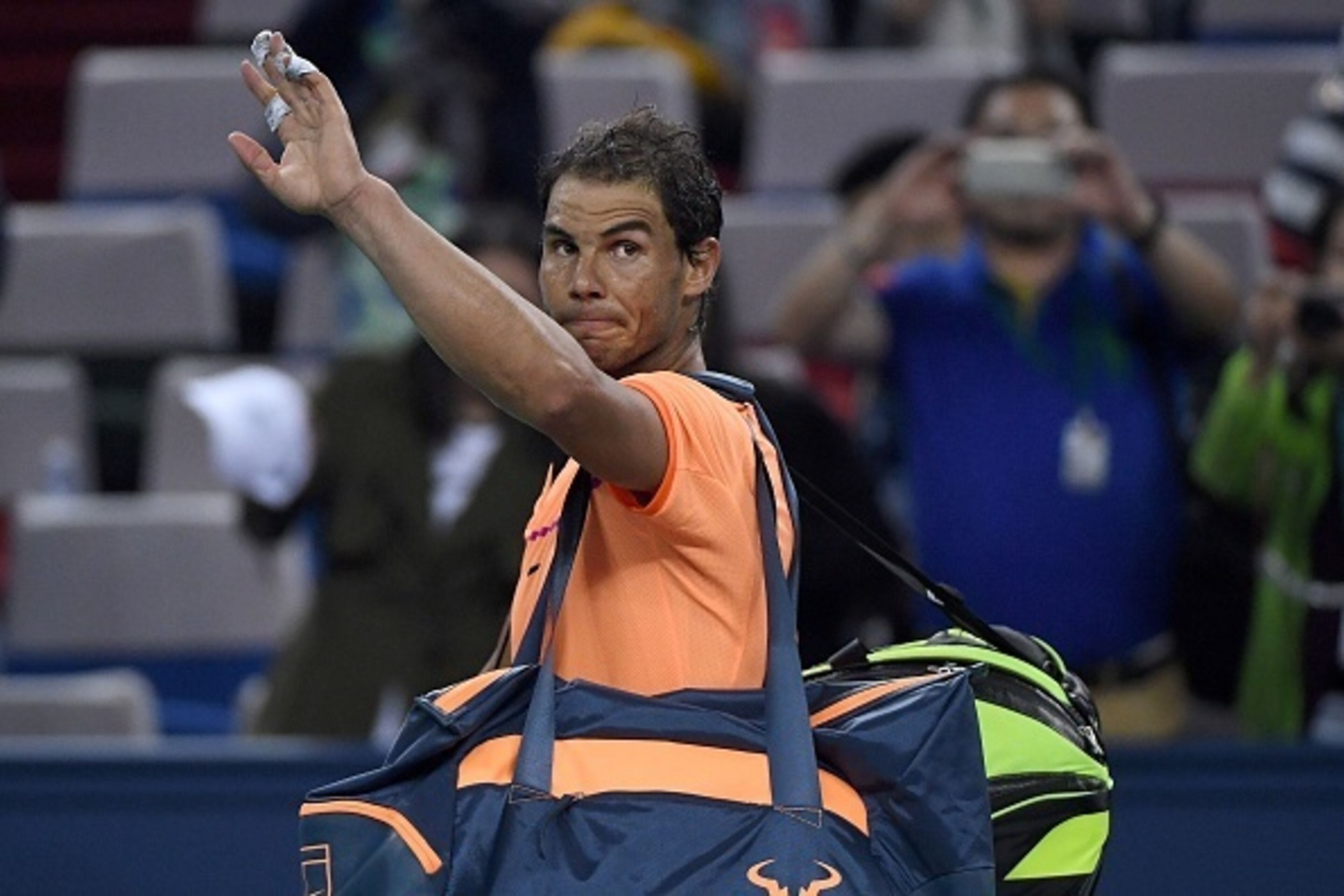Rafael Nadal of Spain waves as he leaves after his men's singles match against Viktor Troicki of Serbia at the Shanghai Masters tennis tournament in Shanghai on October 12, 2016. / AFP / WANG ZHAO (Photo credit should read WANG ZHAO/AFP/Getty Image Rafael Nadal of Spain waves as he leaves after his men's singles match against Viktor Troicki of Serbia at the Shanghai Masters tennis tournament in Shanghai on October 12, 2016. / AFP / WANG ZHAO (Photo credit should read WANG ZHAO/AFP/Getty Image