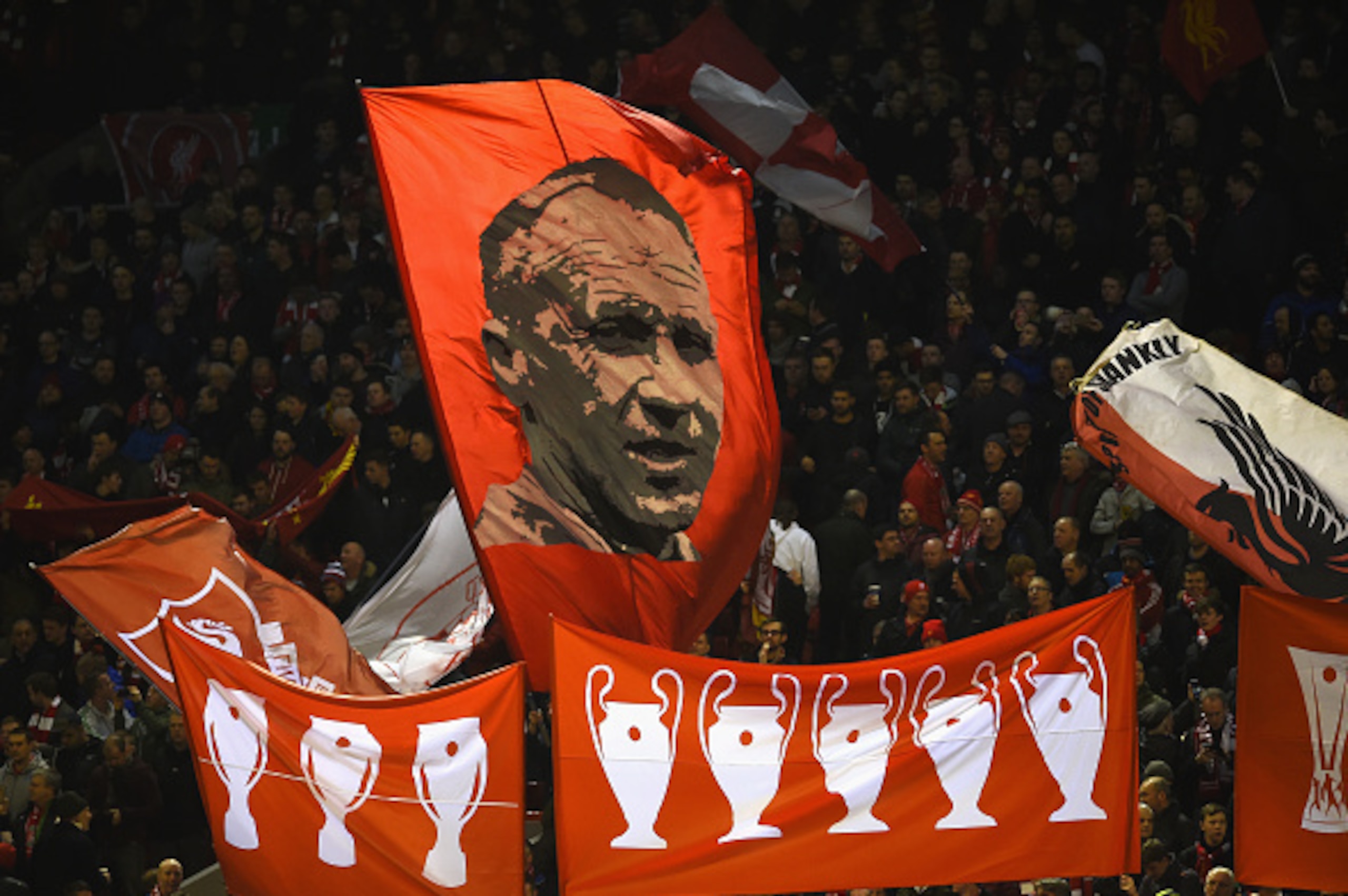 LIVERPOOL, ENGLAND - MARCH 10:  Liverpool fans wave flags and banners prior to the UEFA Europa League Round of 16 first leg match between Liverpool and Manchester United at Anfield on March 10, 2016 in Liverpool, United Kingdom.  (Photo by Laurence Griffi