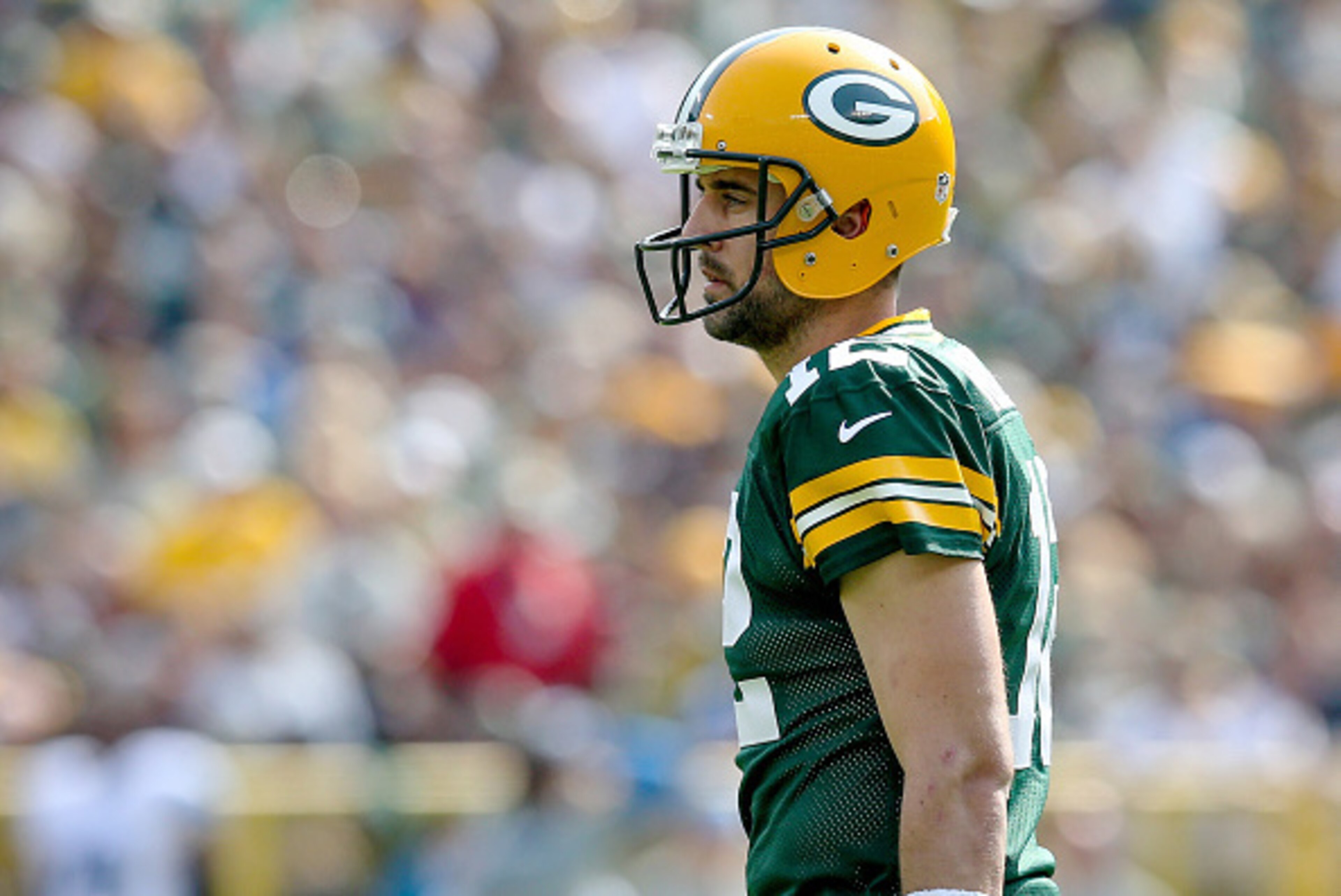 GREEN BAY, WI - SEPTEMBER 25:  Aaron Rodgers #12 of the Green Bay Packers walks across the field in the first quarter against the Detroit Lions at Lambeau Field on September 25, 2016 in Green Bay, Wisconsin. (Photo by Dylan Buell/Getty Images)