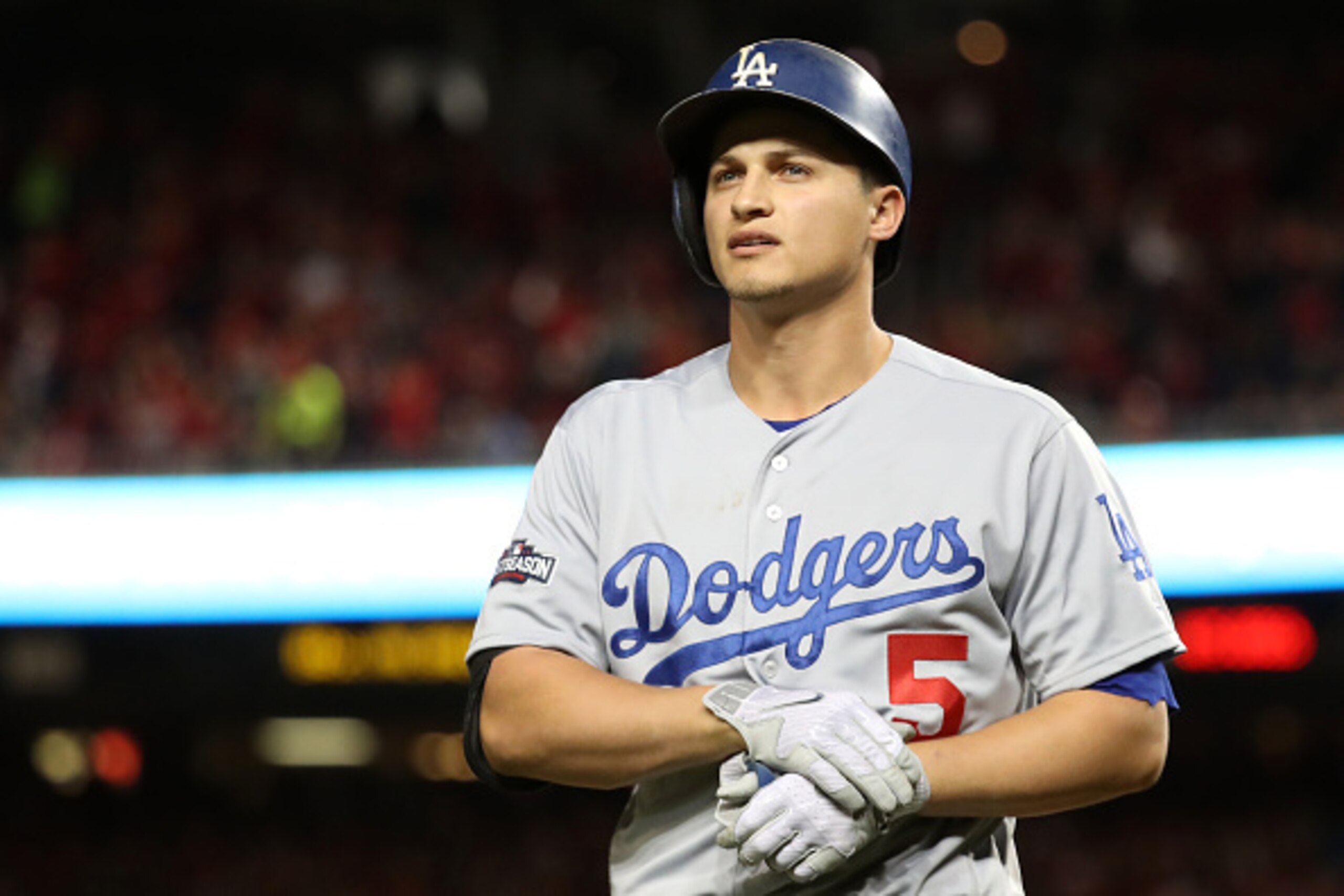 WASHINGTON, DC - OCTOBER 13: Corey Seager #5 of the Los Angeles Dodgers walks off of the field after striking out for the second out of the fourth inning against the Washington Nationals during game five of the National League Division Series at Nationals