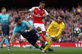 LONDON, ENGLAND - OCTOBER 15: Theo Walcott of Arsenal (C) scores his sides first goal past Lukasz Fabianski of Swansea City (R) during the Premier League match between Arsenal and Swansea City at Emirates Stadium on October 15, 2016 in London, England.  (