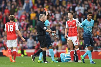LONDON, ENGLAND - OCTOBER 15:  Referee Jonanthan Moss (L) shows Granit Xhaka of Arsenal (R) a red card during the Premier League match between Arsenal and Swansea City at Emirates Stadium on October 15, 2016 in London, England.  (Photo by Mike Hewitt/Gett