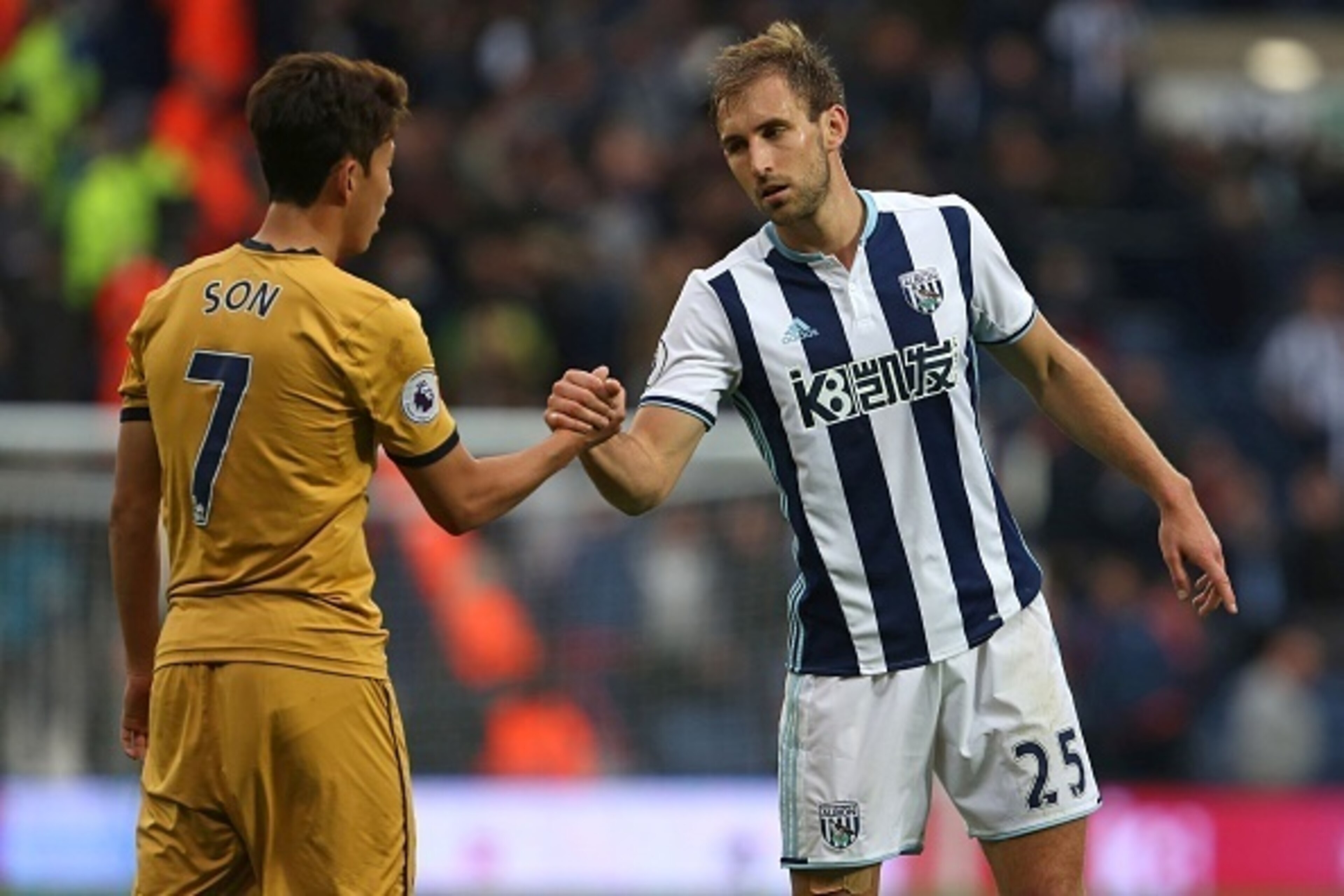 West Bromwich Albion's English defender Craig Dawson (R) shakes hands with Tottenham Hotspur's South Korean striker Son Heung-Min (L) after the English Premier League football match between West Bromwich Albion and Tottenham Hotspur at The Hawthorns stadi