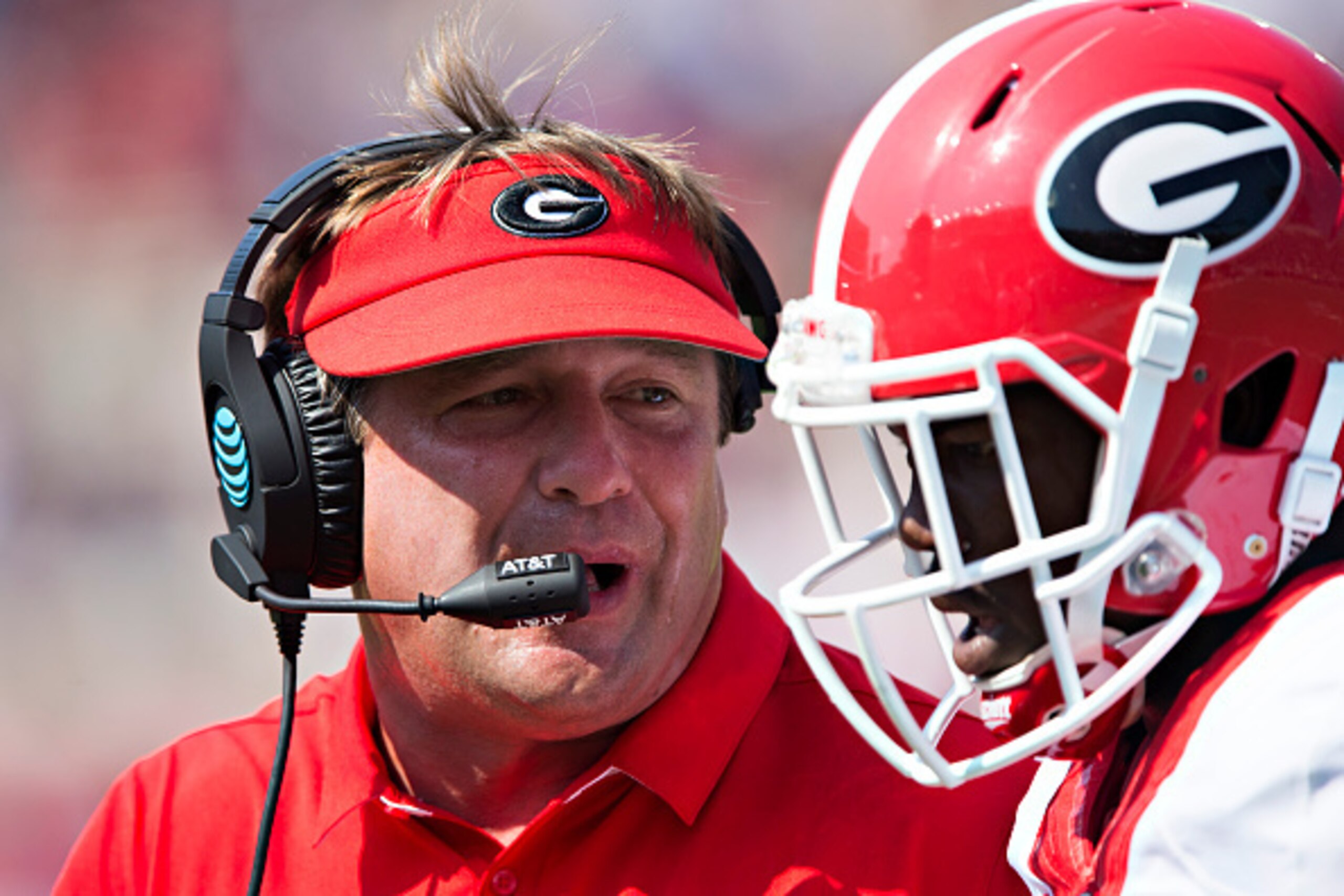 OXFORD, MS - SEPTEMBER 24:  Head Coach Kirby Smart of the Georgia Bulldogs talks with one of his players during a game against the Mississippi Rebels at Vaught-Hemingway Stadium on September 24, 2016 in Oxford, Mississippi.  The Rebels defeated the Bulldo
