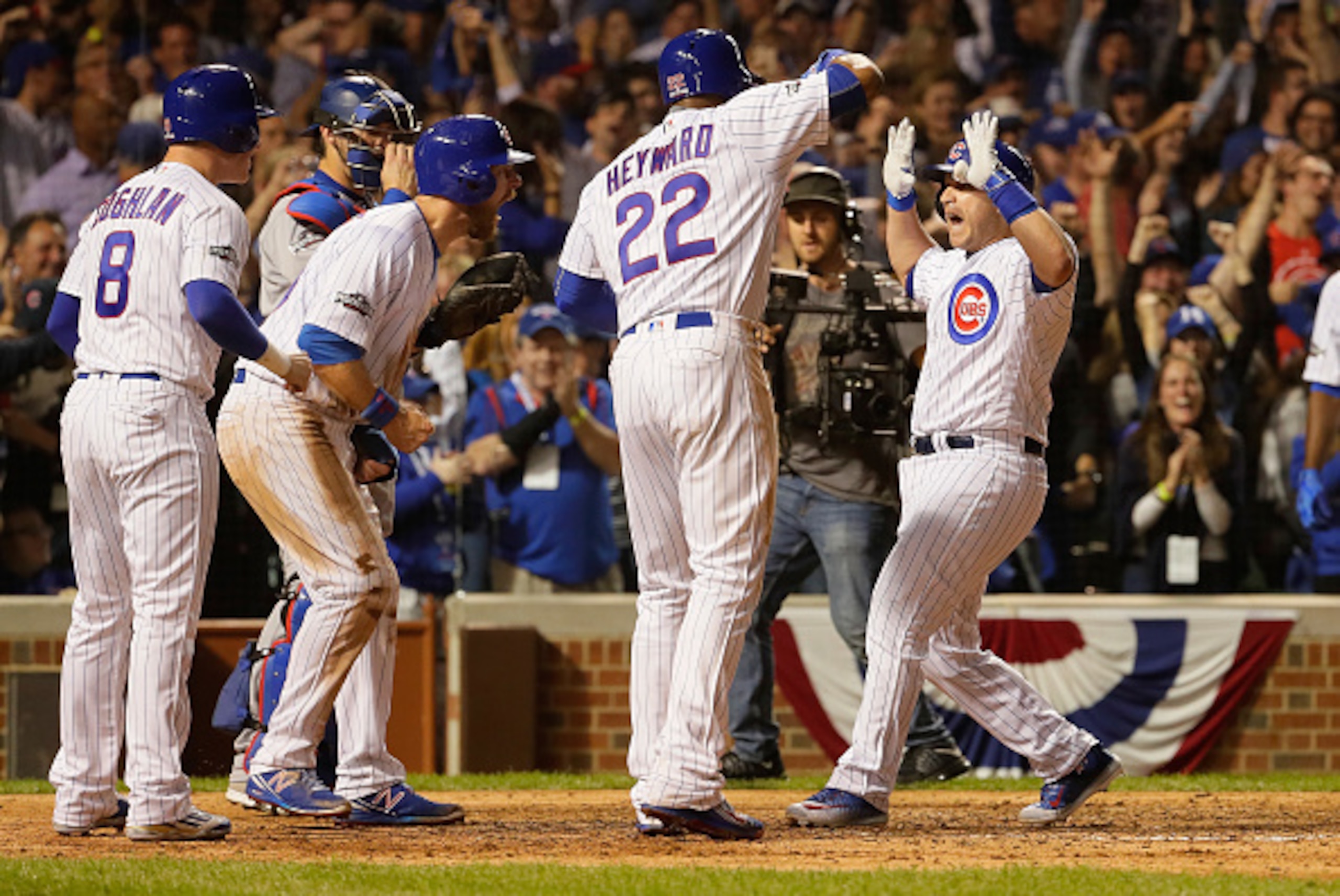 CHICAGO, IL - OCTOBER 15:  Miguel Montero #47 of the Chicago Cubs celebrates with Jason Heyward #22, Chris Coghlan #8 and Ben Zobrist #18 after hitting a grand slam home run in the eighth inning against the Los Angeles Dodgers during game one of the Natio